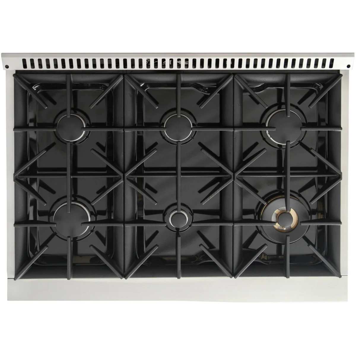 Kucht dual fuel range cooktop with black burner grates and brass burner cap.