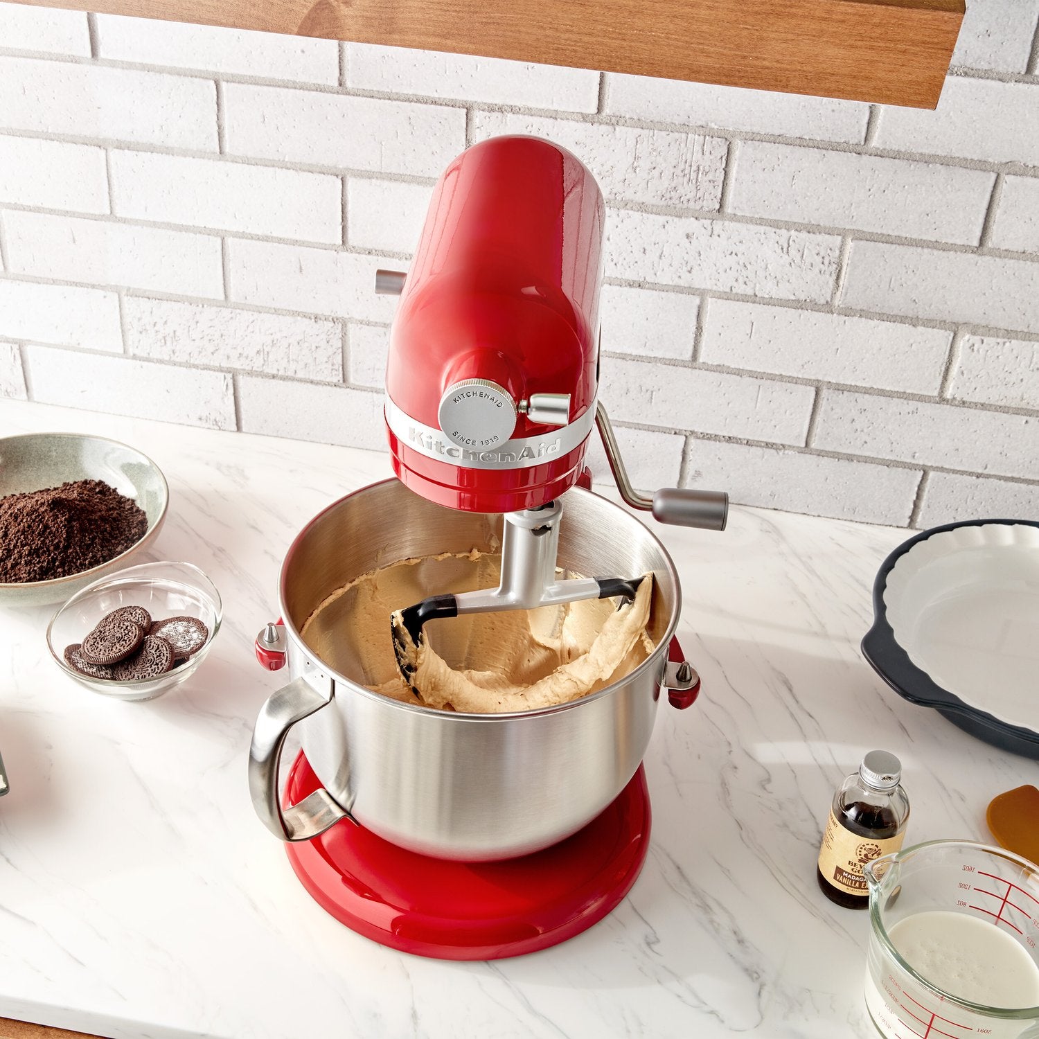 Double flex edge beater mixing dough in a stainless bowl on a stand mixer