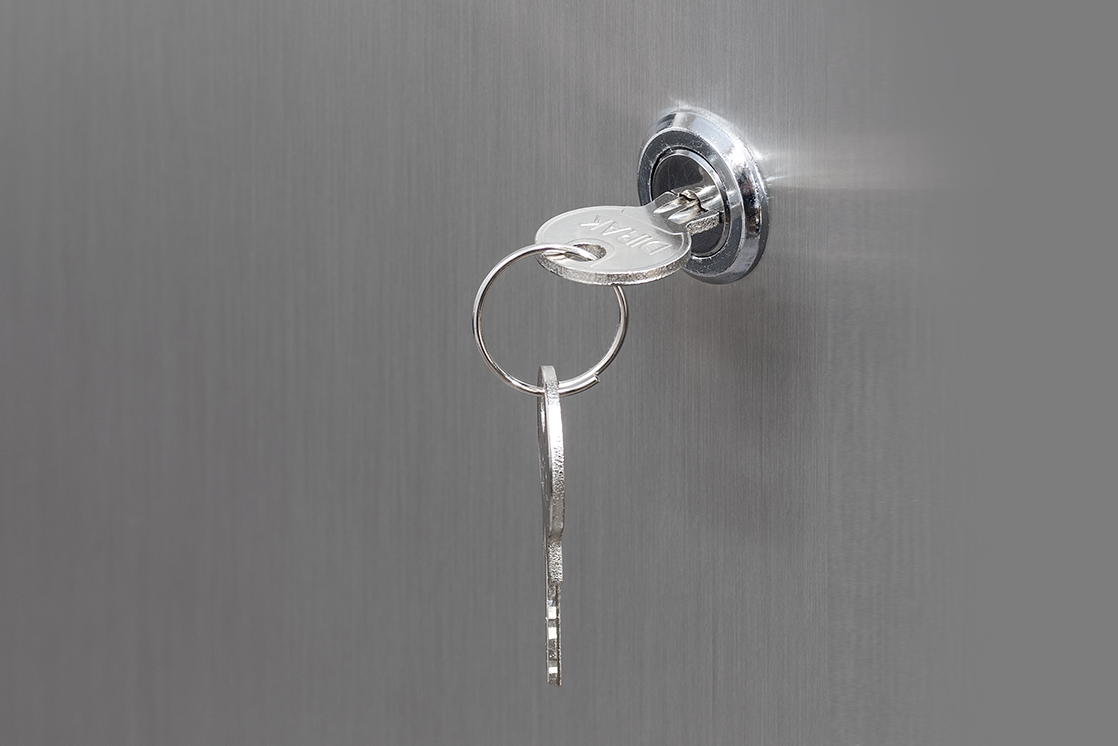 Stainless lock cylinder with two keys on a flush-mounted door station letterbox