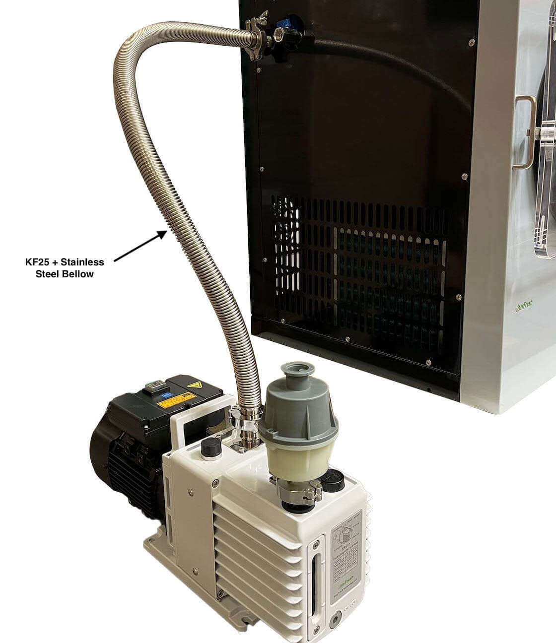 Freeze dryer chamber with steel bellows hose and stainless pump connected for vacuum
