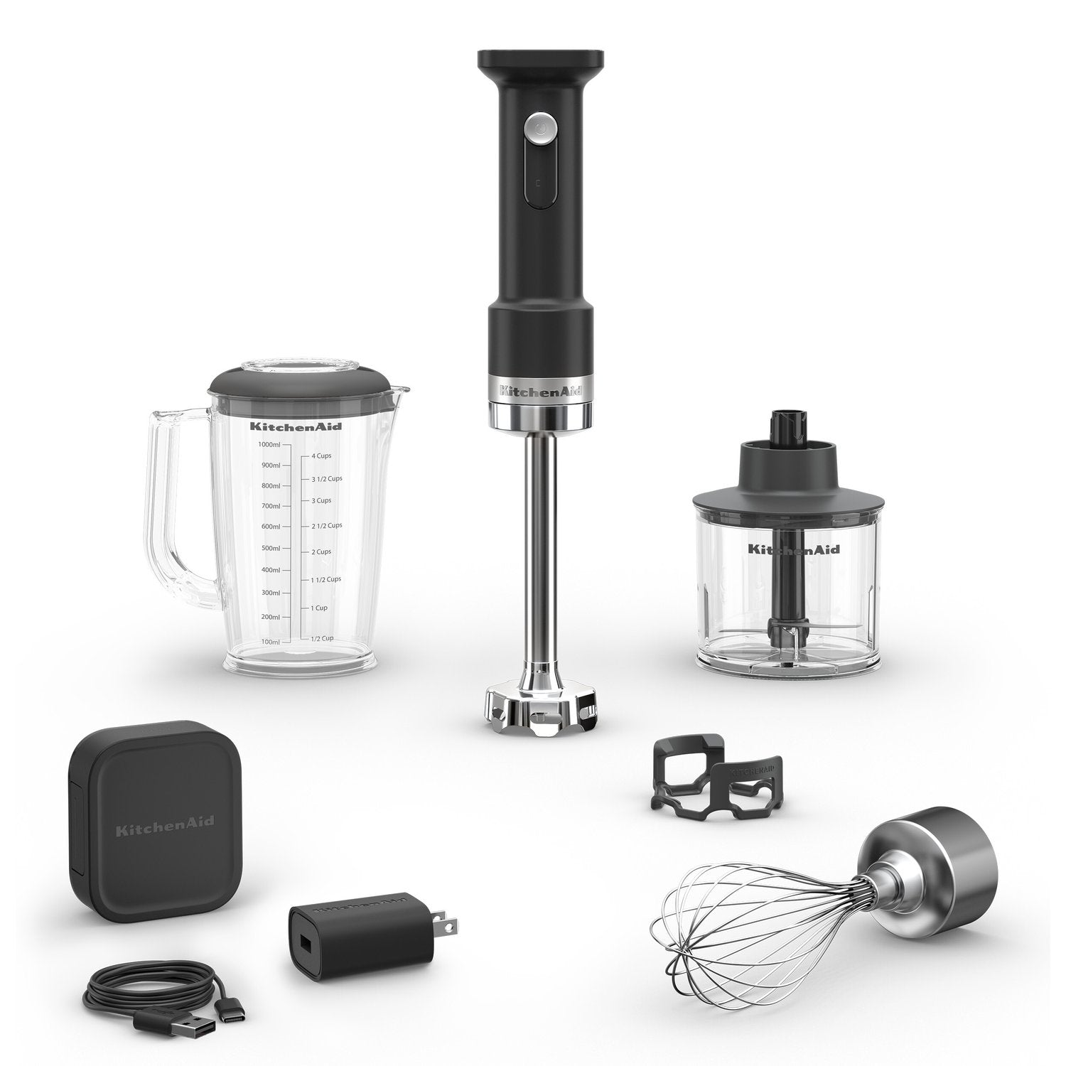 Black matte cordless hand blender set with pitcher, whisk and chopper attachments.