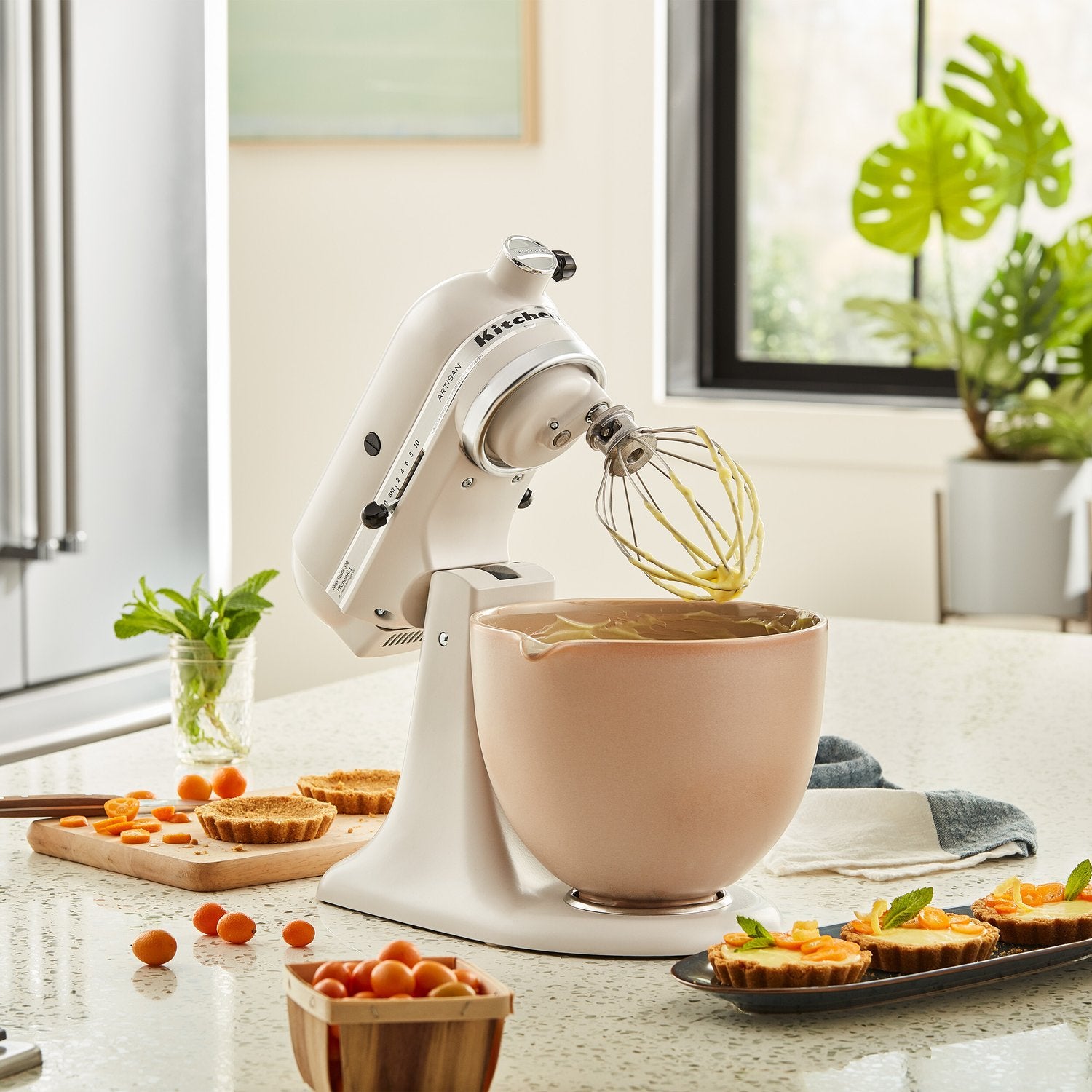 Ceramic mixing bowl on stand mixer, fired clay tan with interior bowl opening