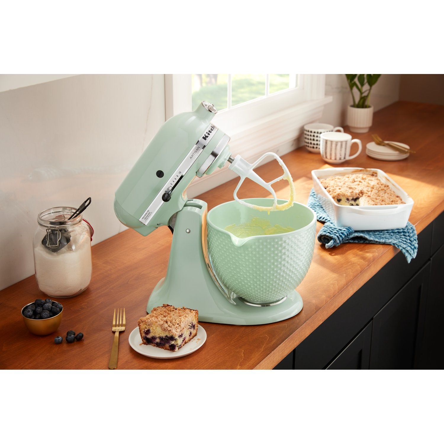 Mint green ceramic mixing bowl with textured finish and wide rim