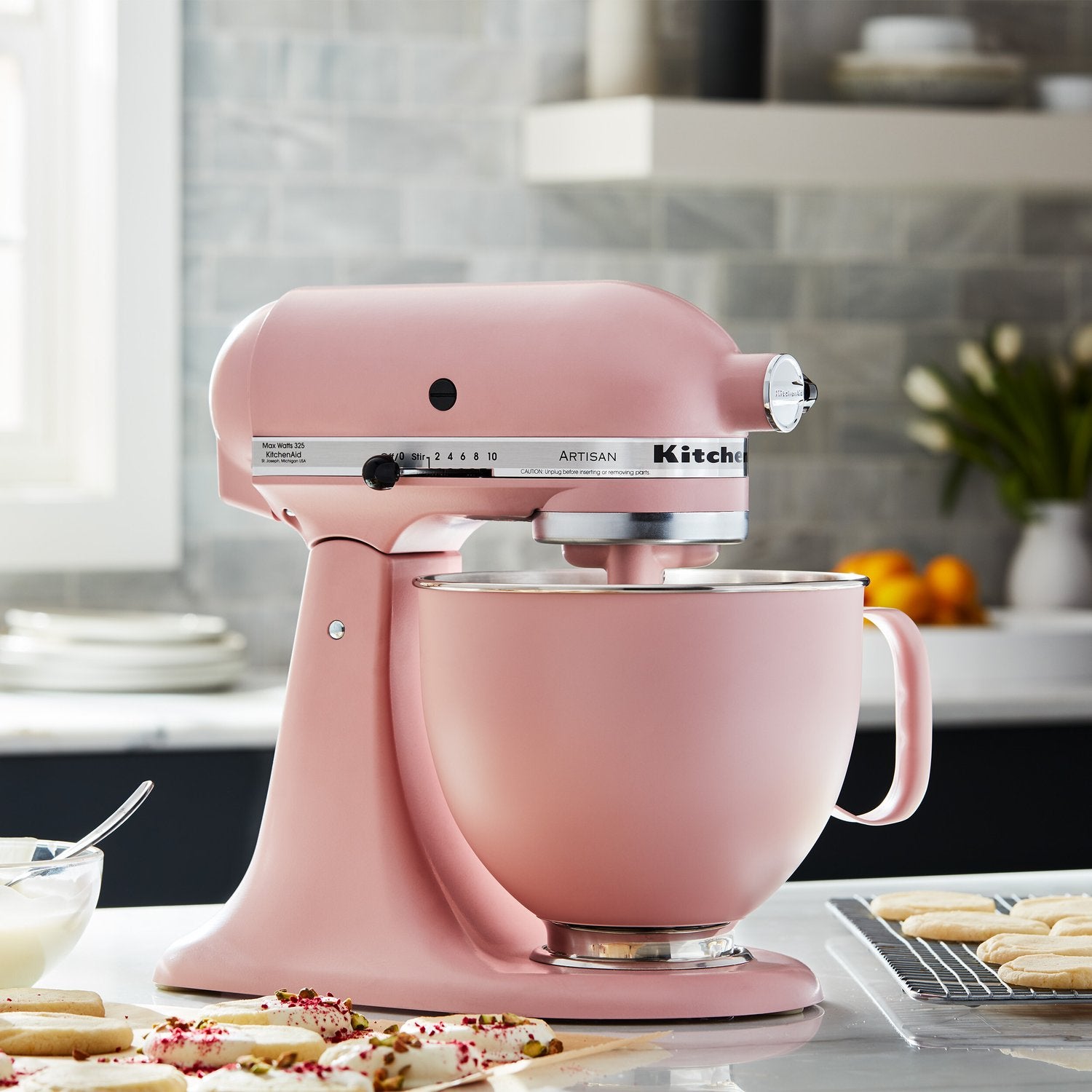 KitchenAid matte dried rose mixing bowl with stainless rim, attached to stand mixer