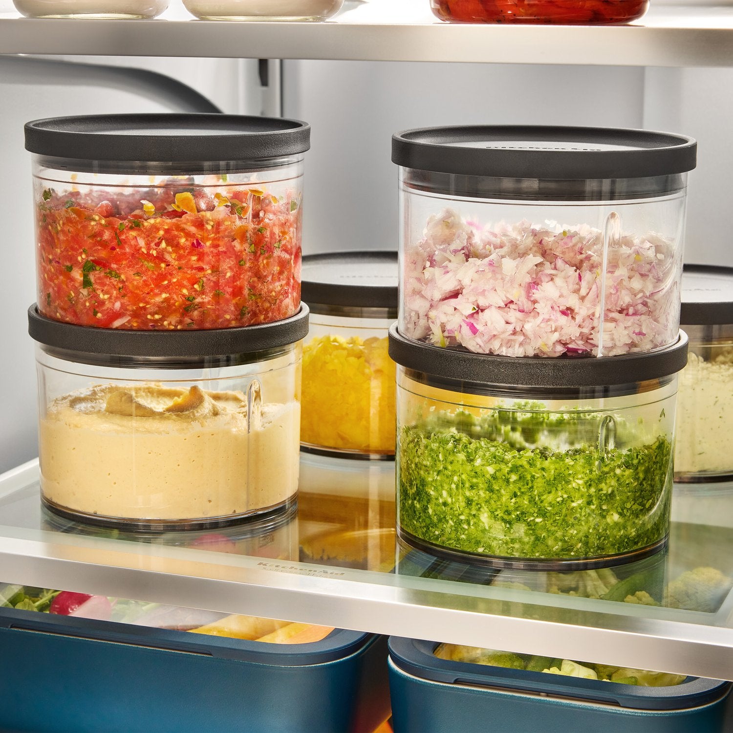 Counter display of clear bowls with mixed chopped fillings and black chopper tops