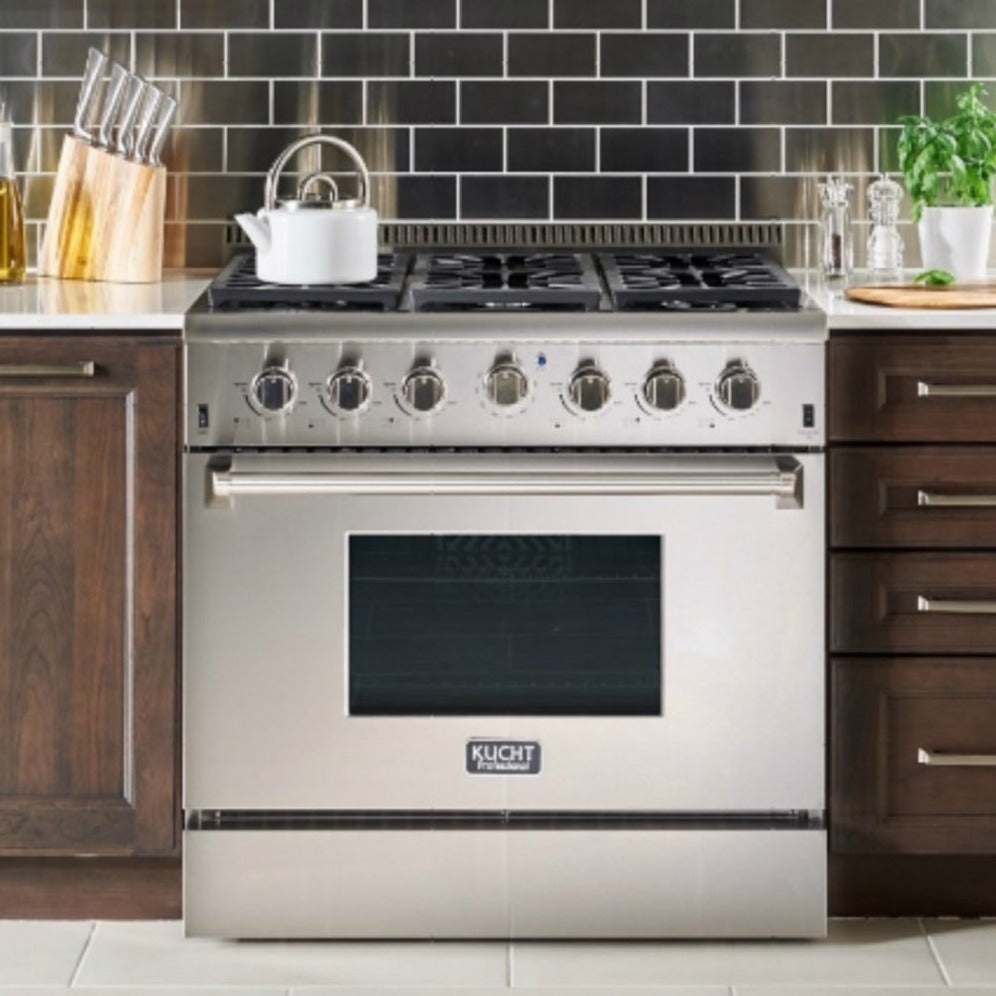 Stainless steel propane gas range in kitchen setting with top grates and oven door