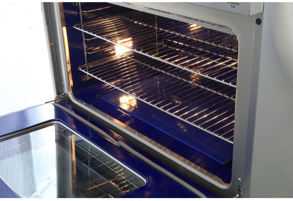 Convection oven interior with wire racks and glowing heating elements