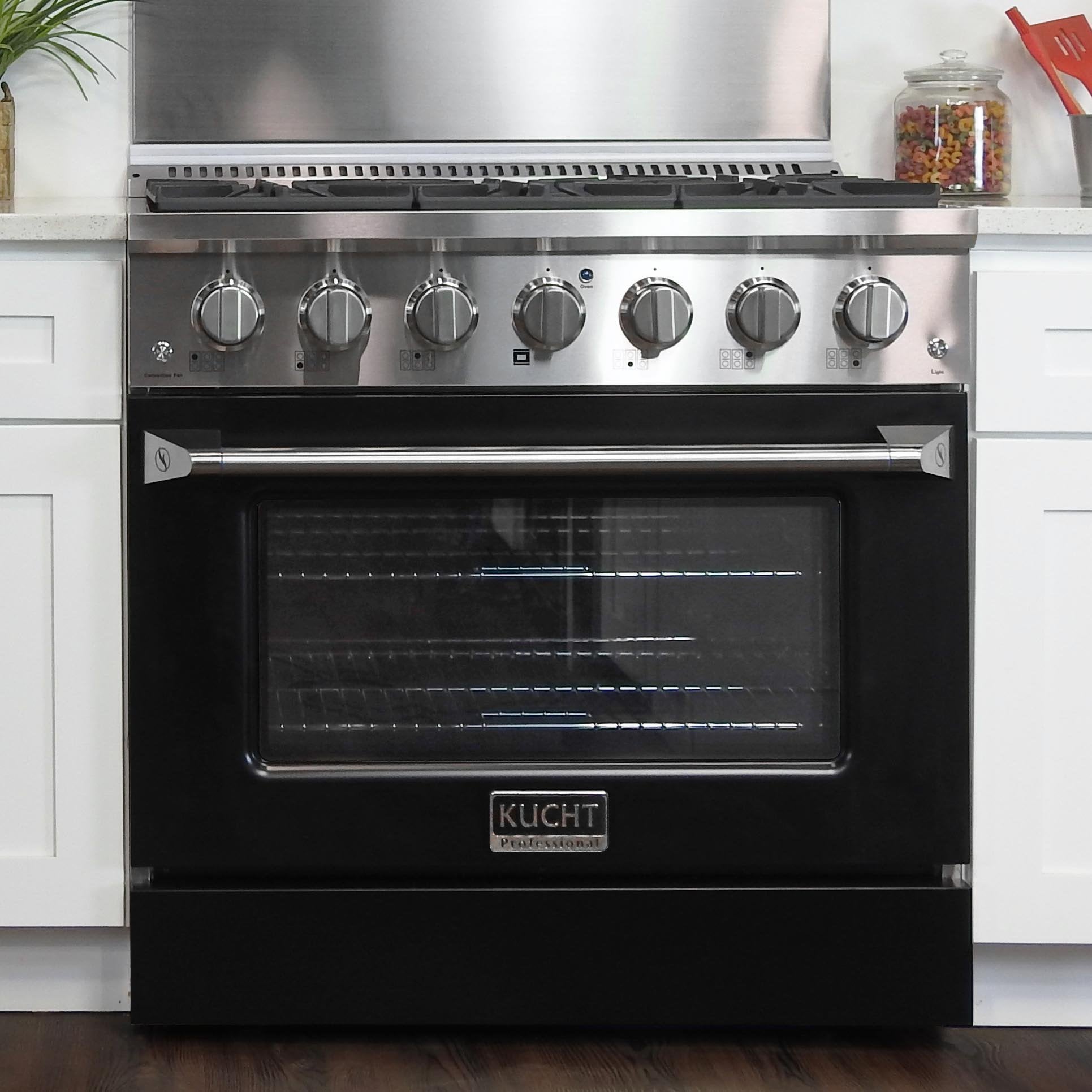 Black propane range with open oven door, oven racks, and control knobs across top