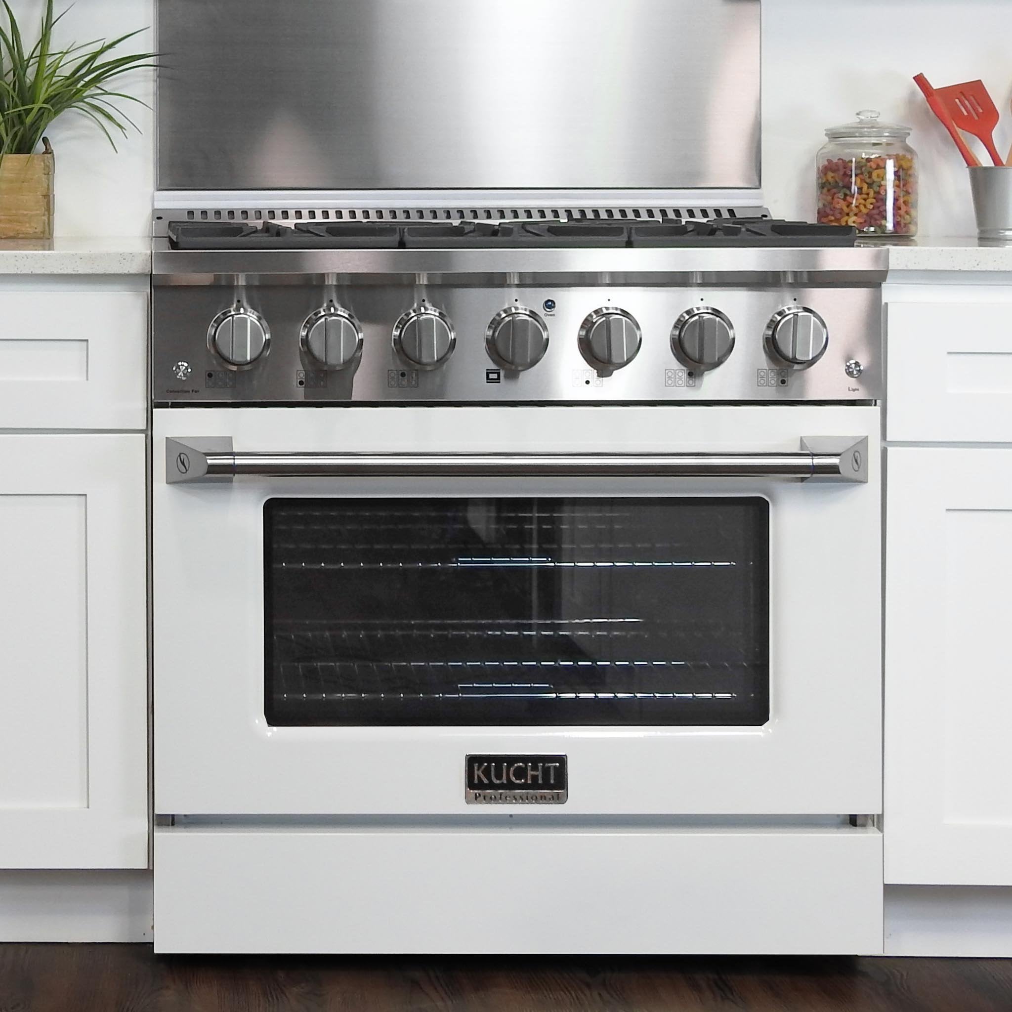 White propane gas range front with burner knobs and oven door window, Kucht logo.