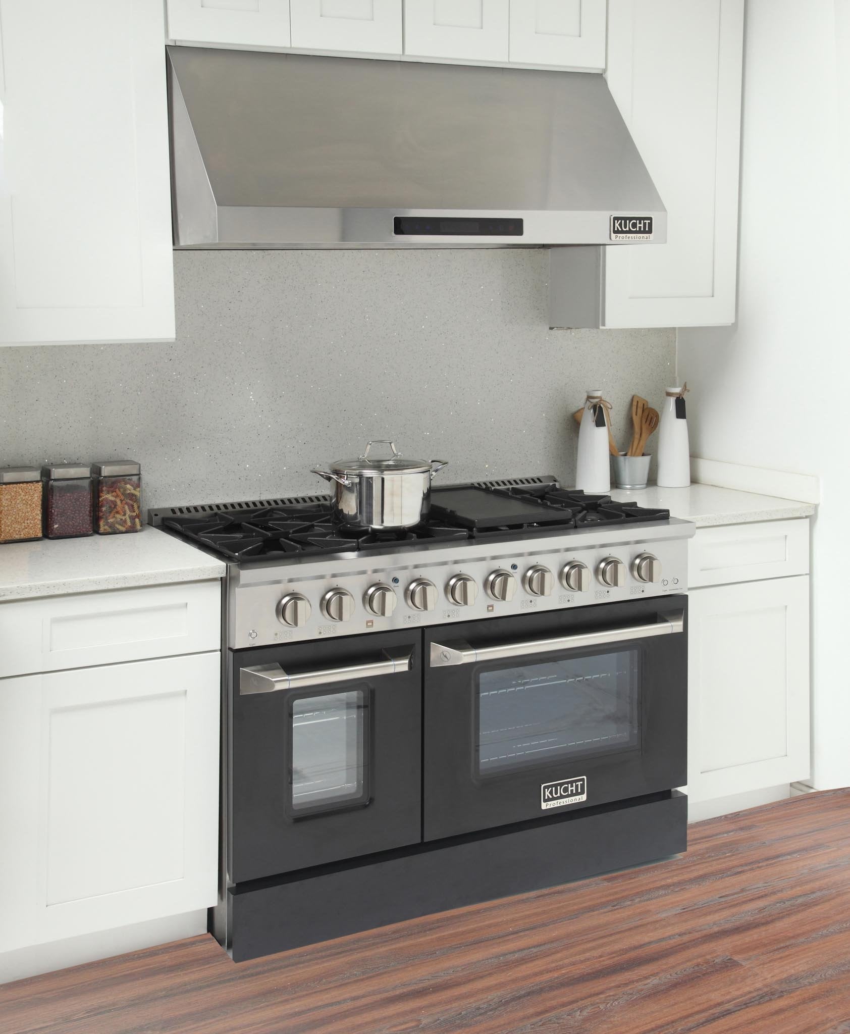Black propane gas range with open-top burner grates, griddle, and two oven doors