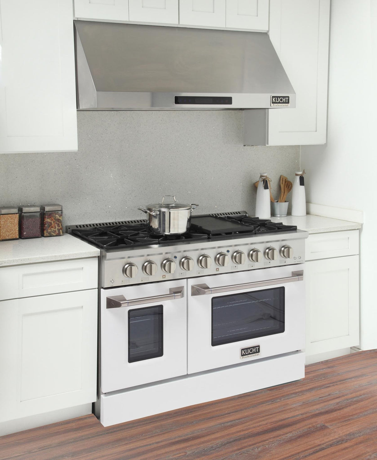 White propane gas range with six burners and dual ovens, shown with cookware