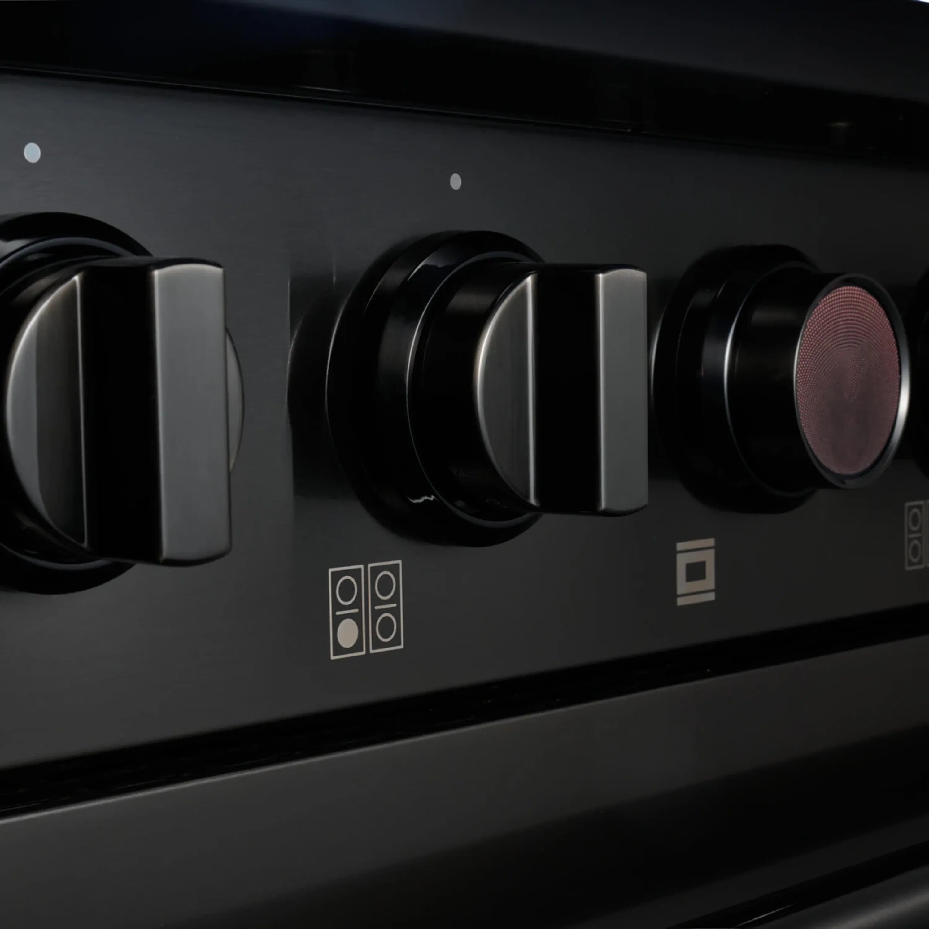 Gas dual-fuel range control panel with black knob set and brushed stainless face