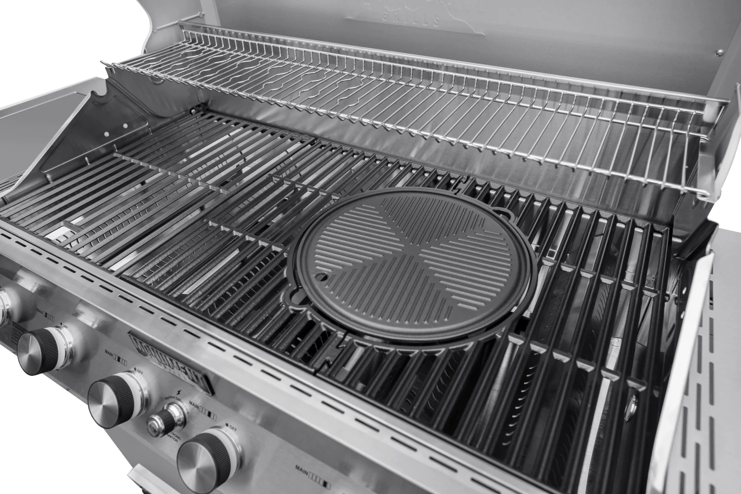 Round cast iron cooking plate seated on a grill grate with ridged cooking surface
