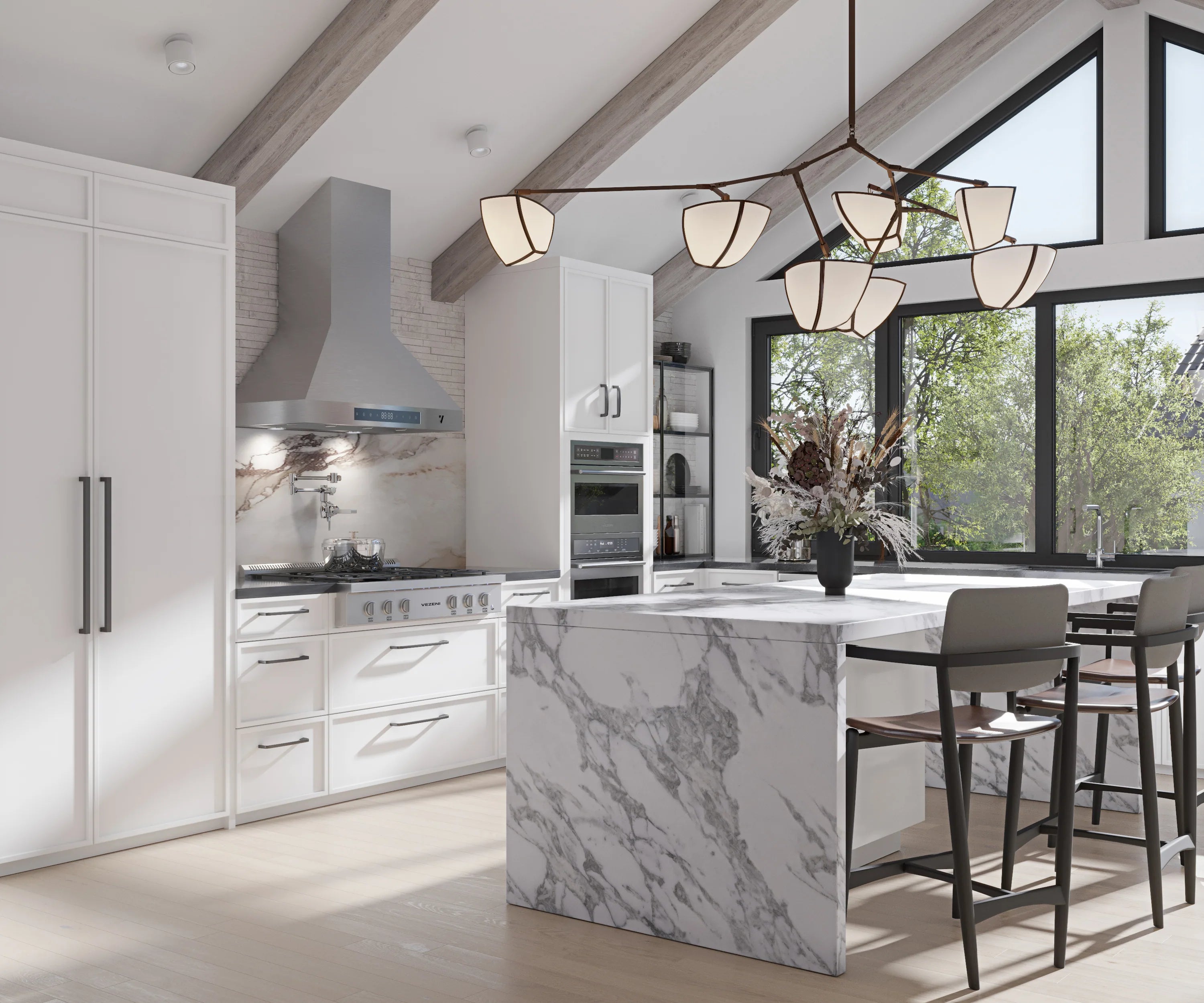 Stainless steel range hood above stove with tall chimney section in modern kitchen.