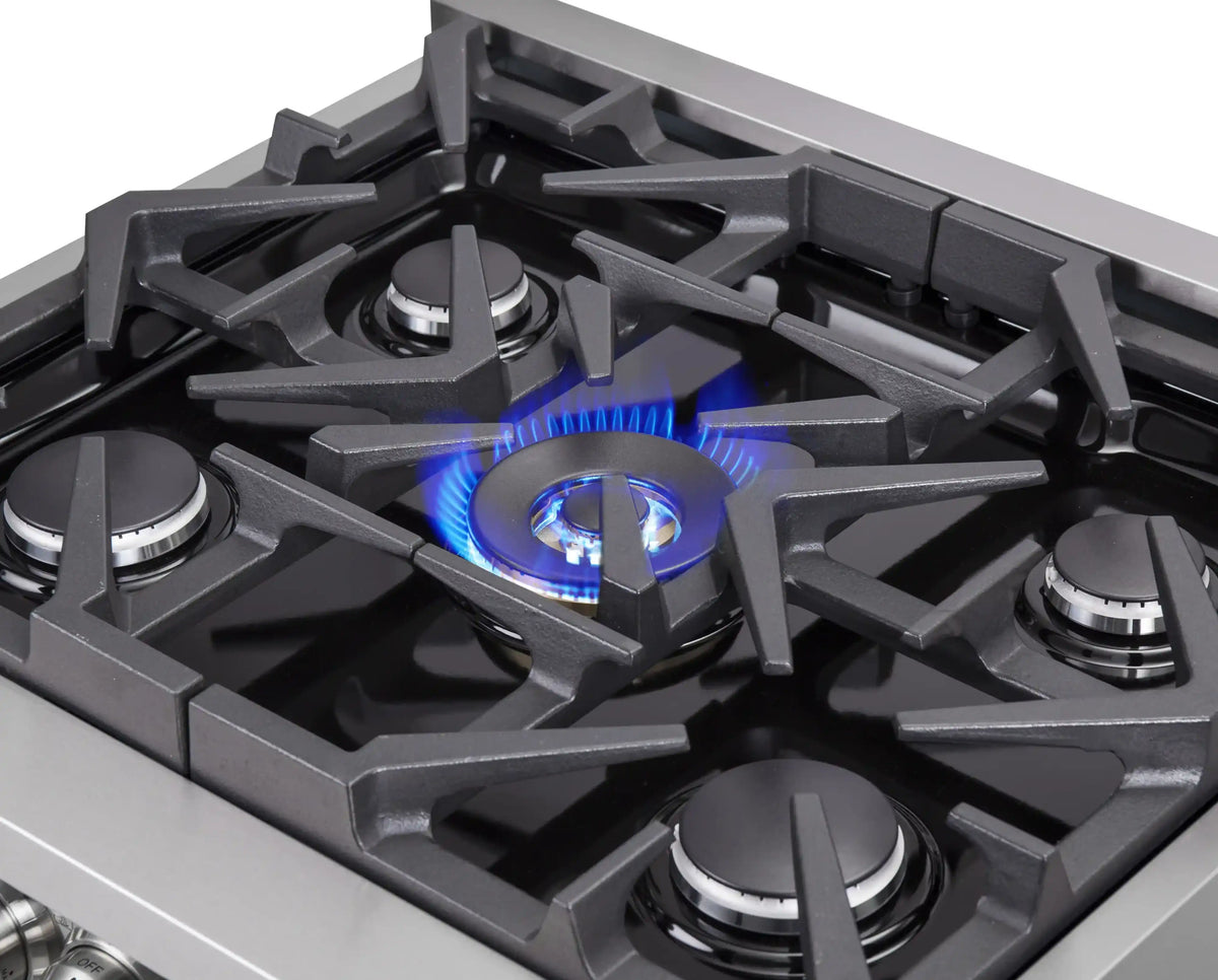 Stainless steel gas range cooktop with lit blue burners and black burner grates