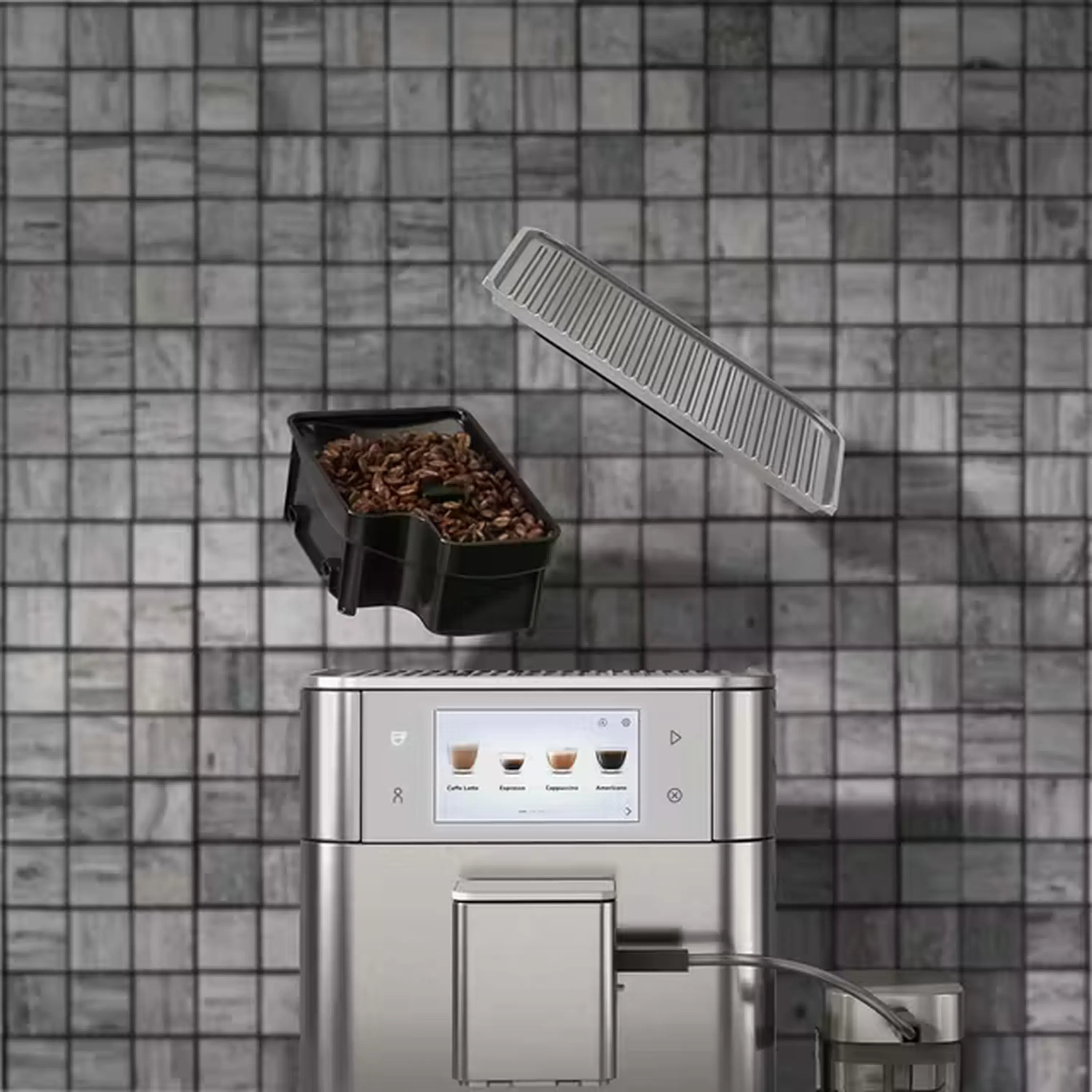 Fully automatic espresso machine showing bean hopper slide above coffee maker