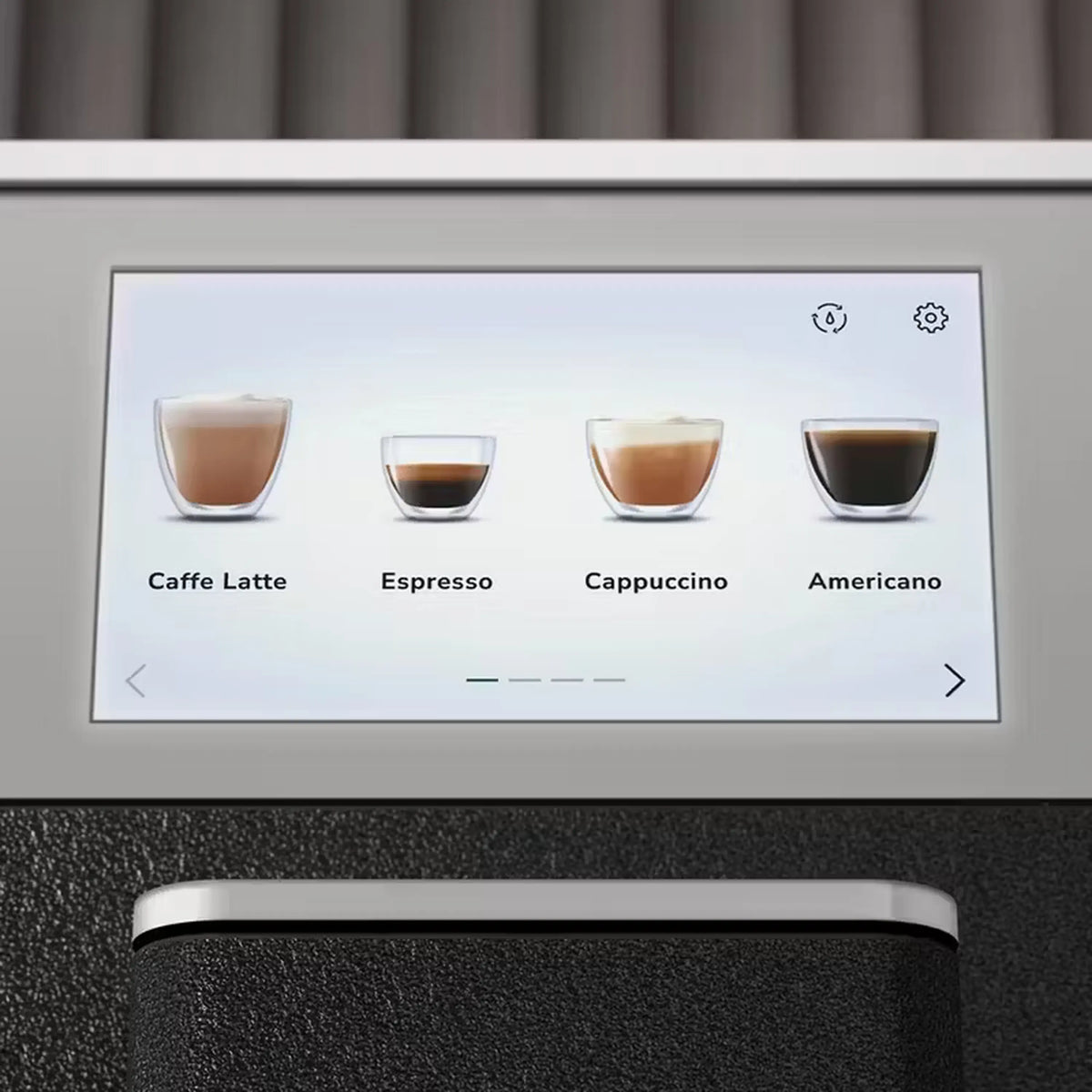 Fully automatic espresso machine touchscreen showing Caffe Latte, Espresso, Cappuccino, Americano