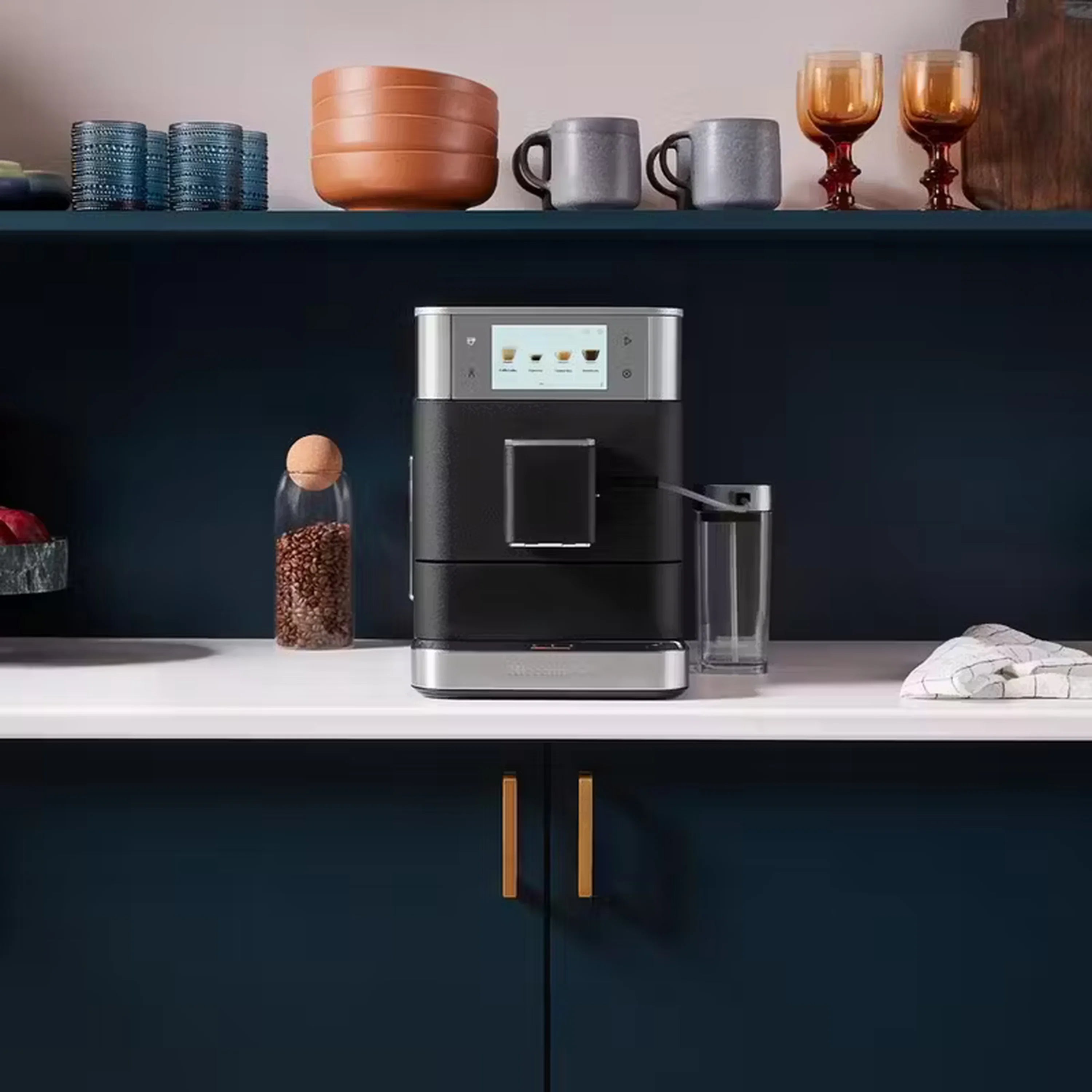 Black fully automatic espresso machine with front display and clear milk container