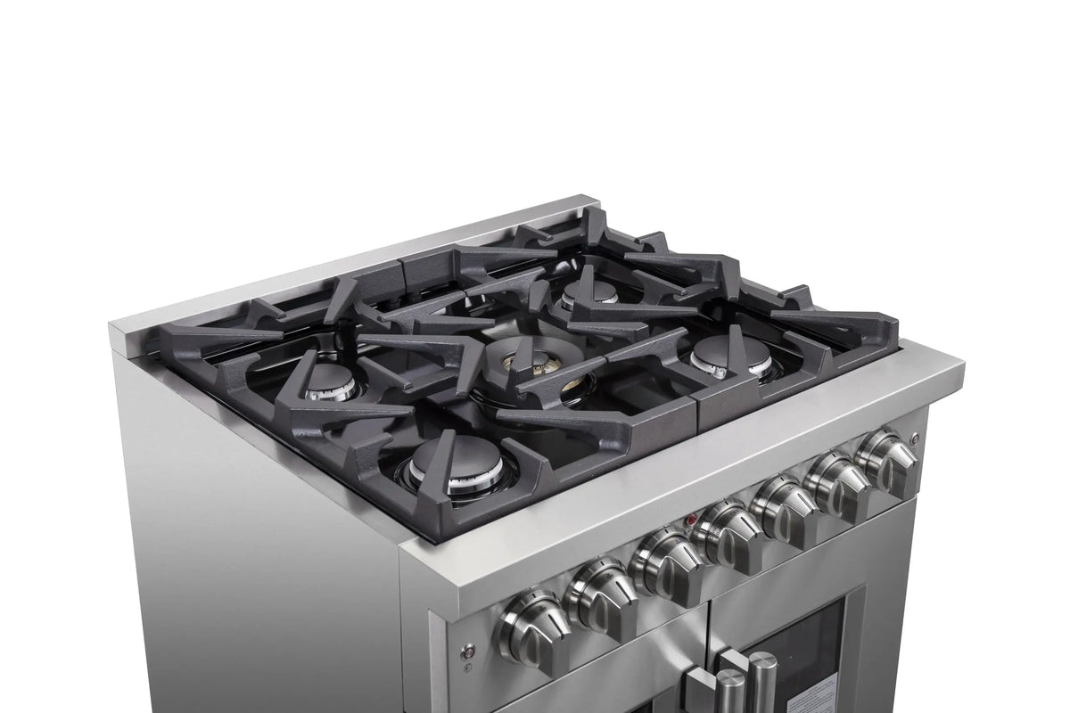 Stainless steel gas range cooktop with black grates and multiple burner heads