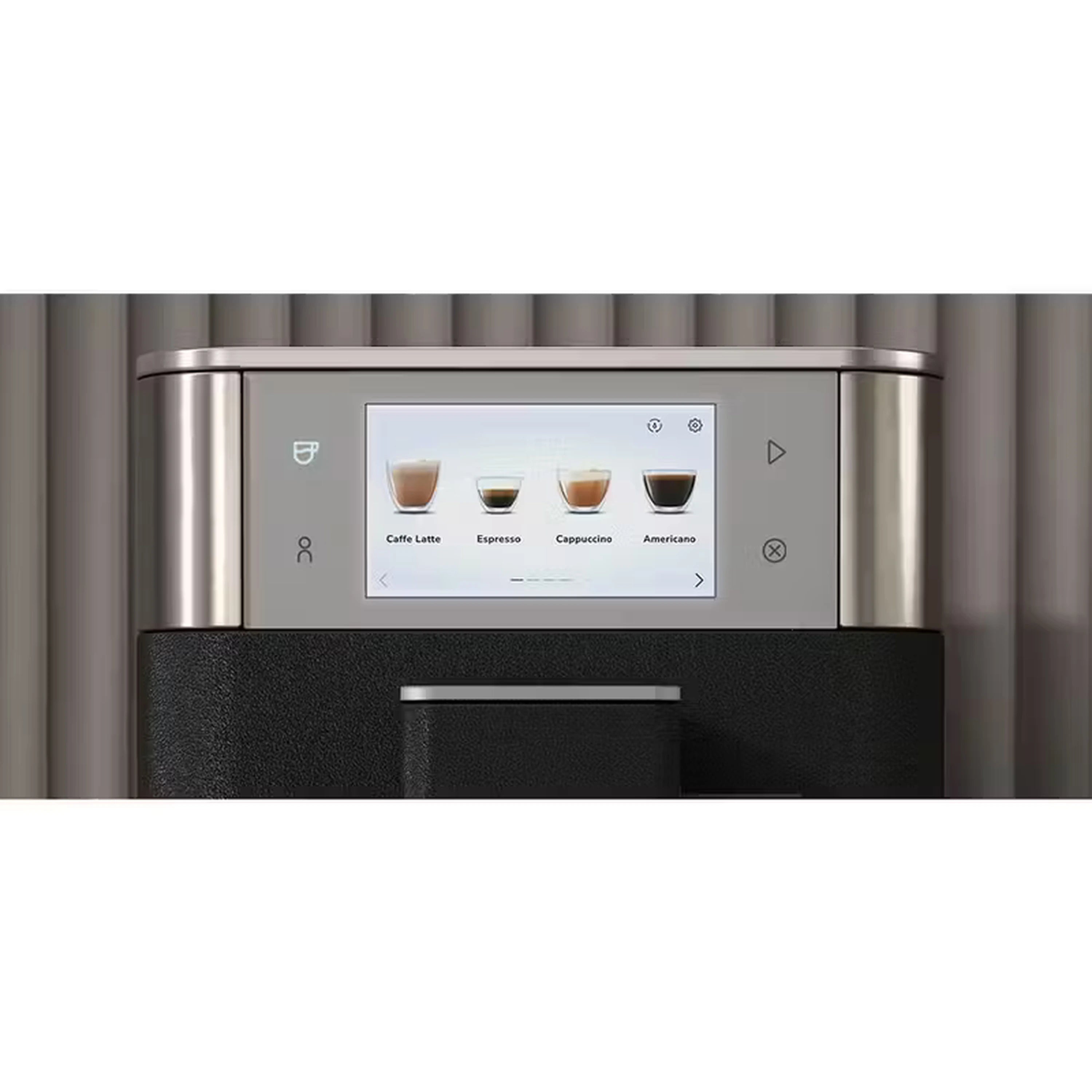 Black and stainless espresso machine front with illuminated menu display panel.