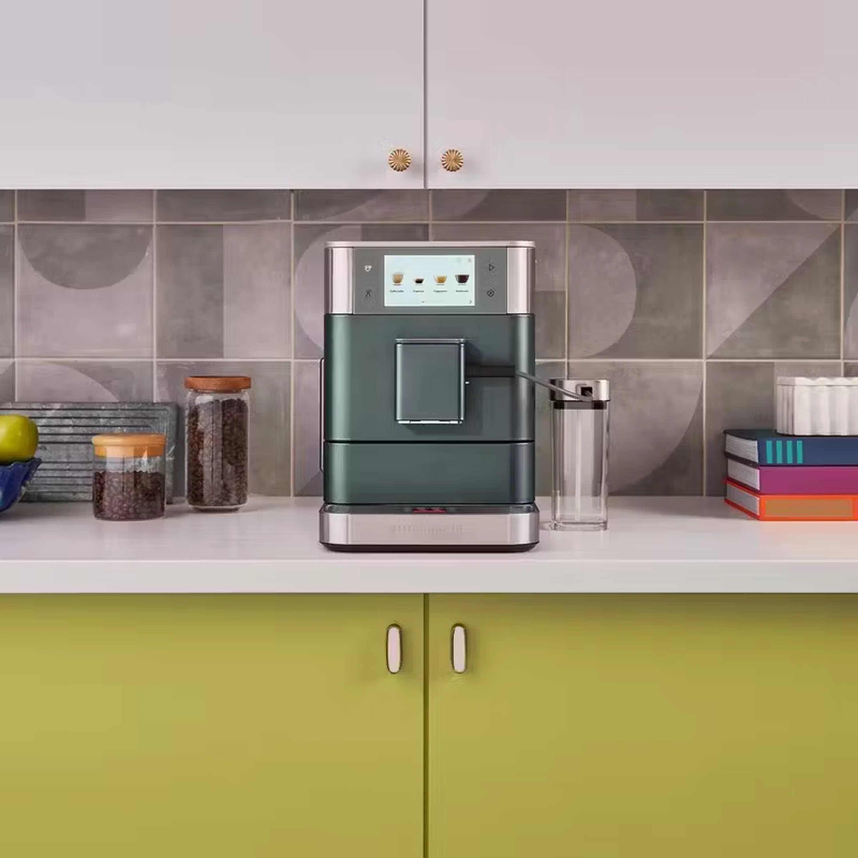 Fully automatic espresso machine with milk container on kitchen counter behind tiled backsplash