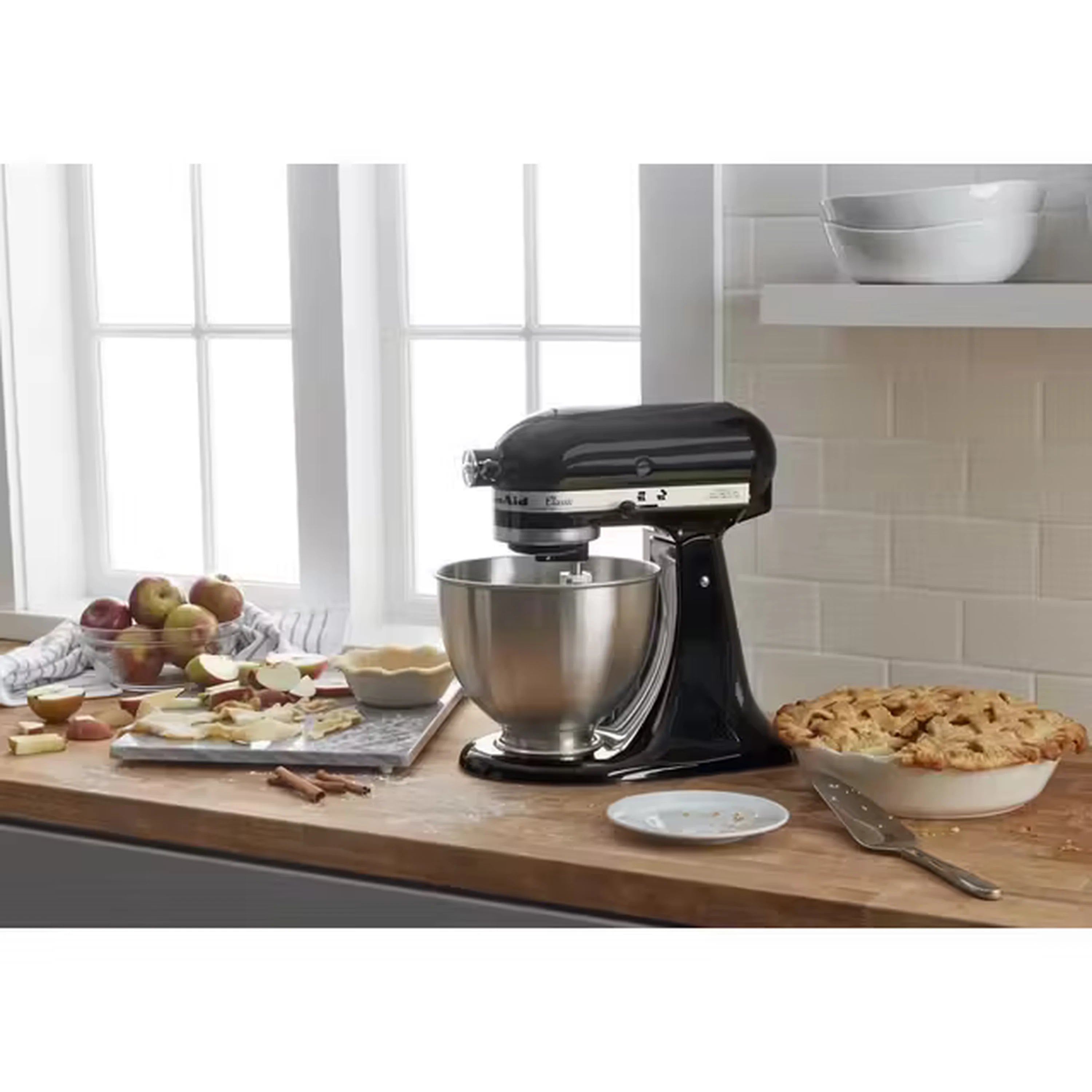 Onyx black tilt-head stand mixer with stainless bowl on countertop