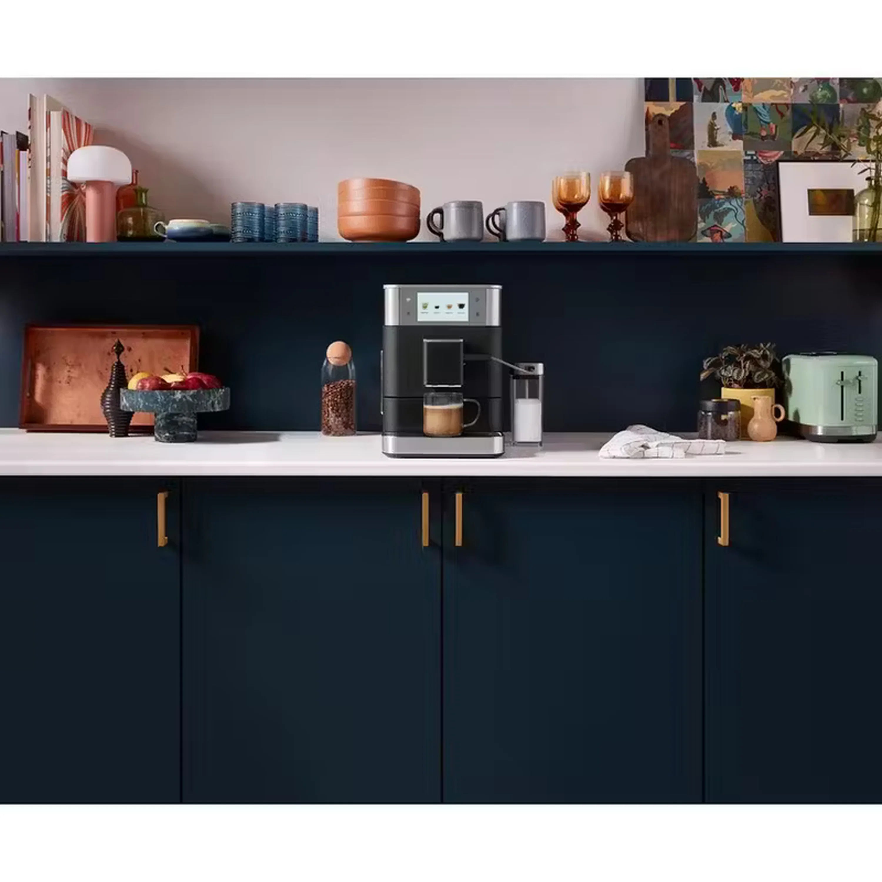 Black and stainless fully automatic espresso machine on kitchen counter with milk container.