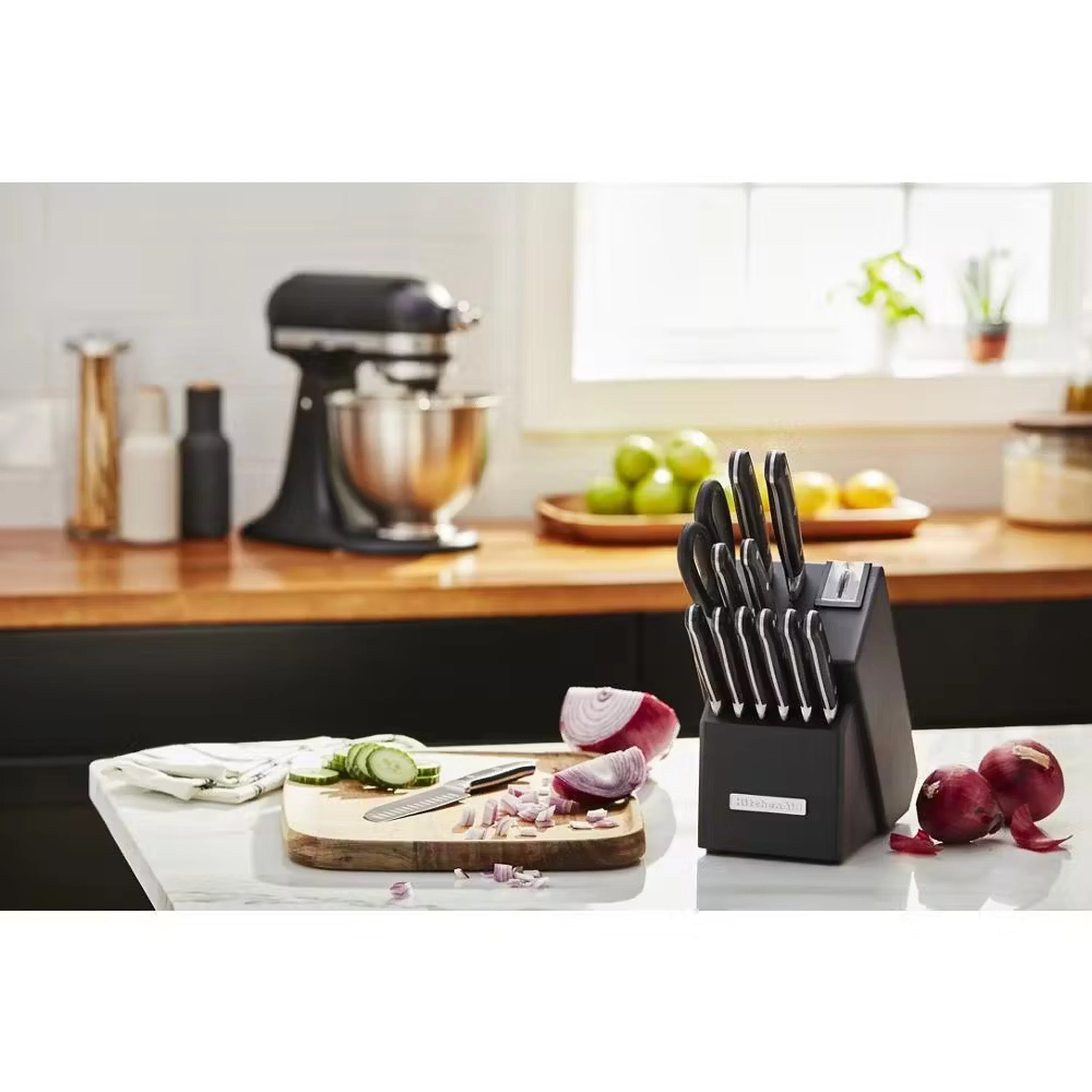 Onyx black stand mixer with stainless bowl and utensil holder