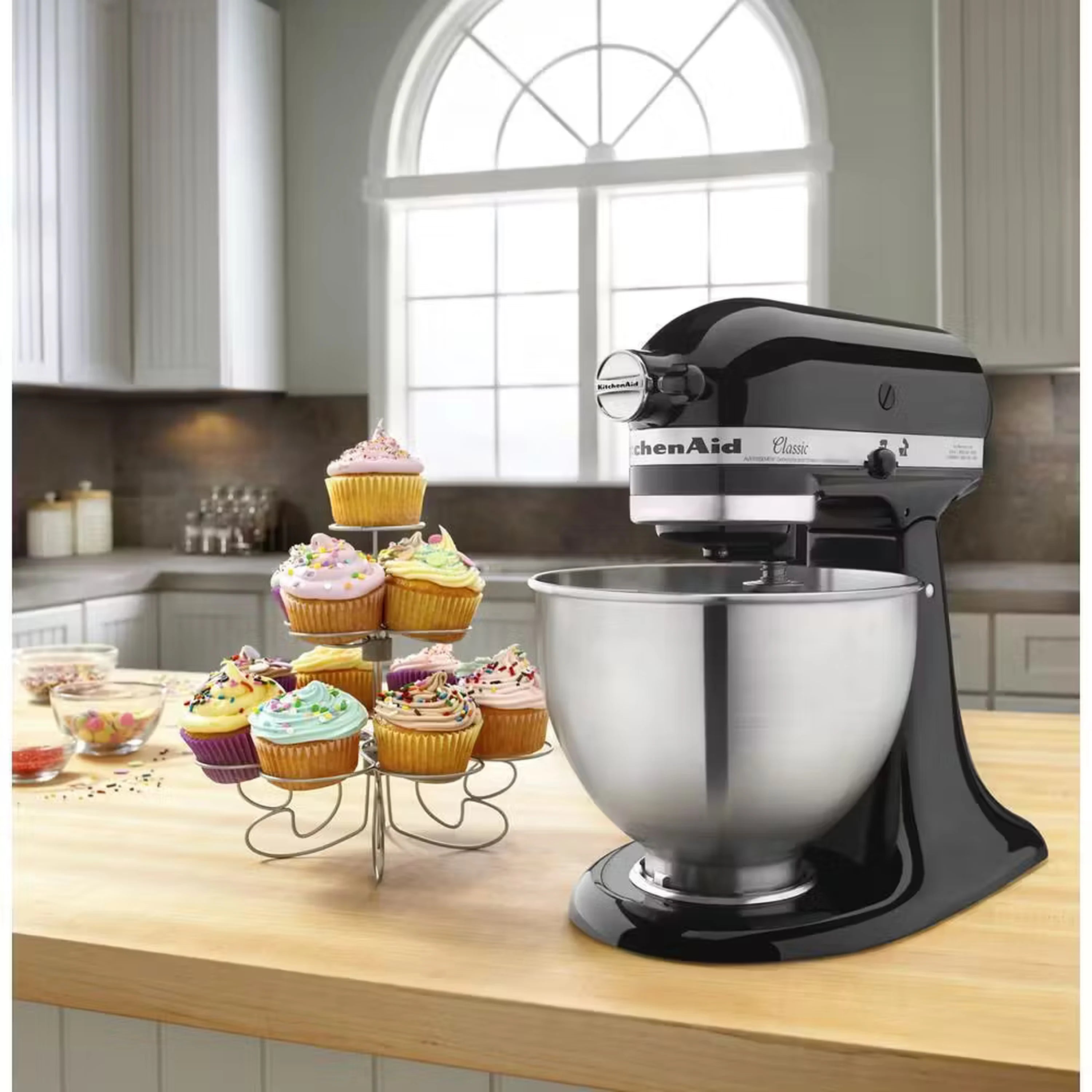 Onyx black tilt-head stand mixer with stainless bowl on kitchen counter