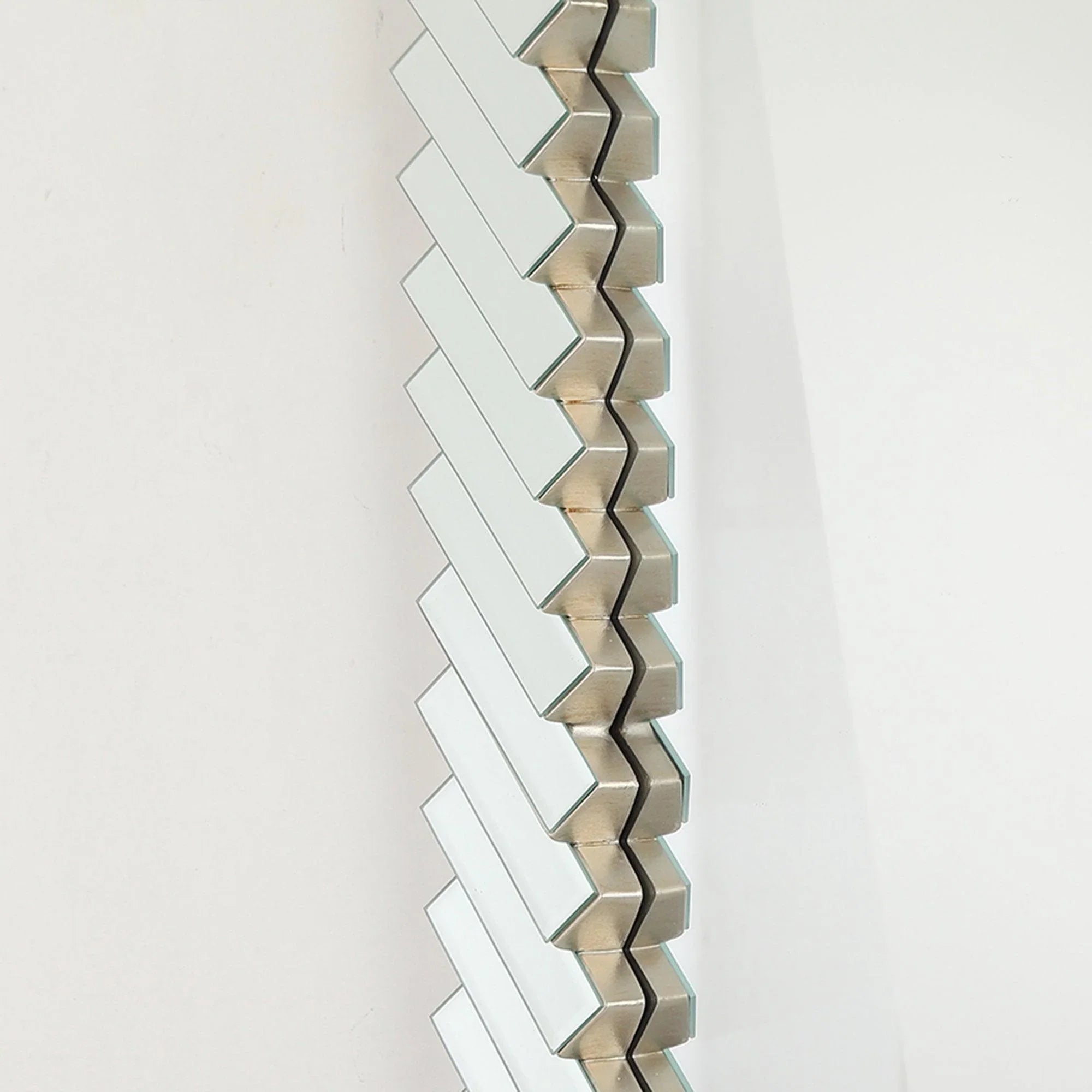 Side profile view of silver slat frame on a rectangular mirror