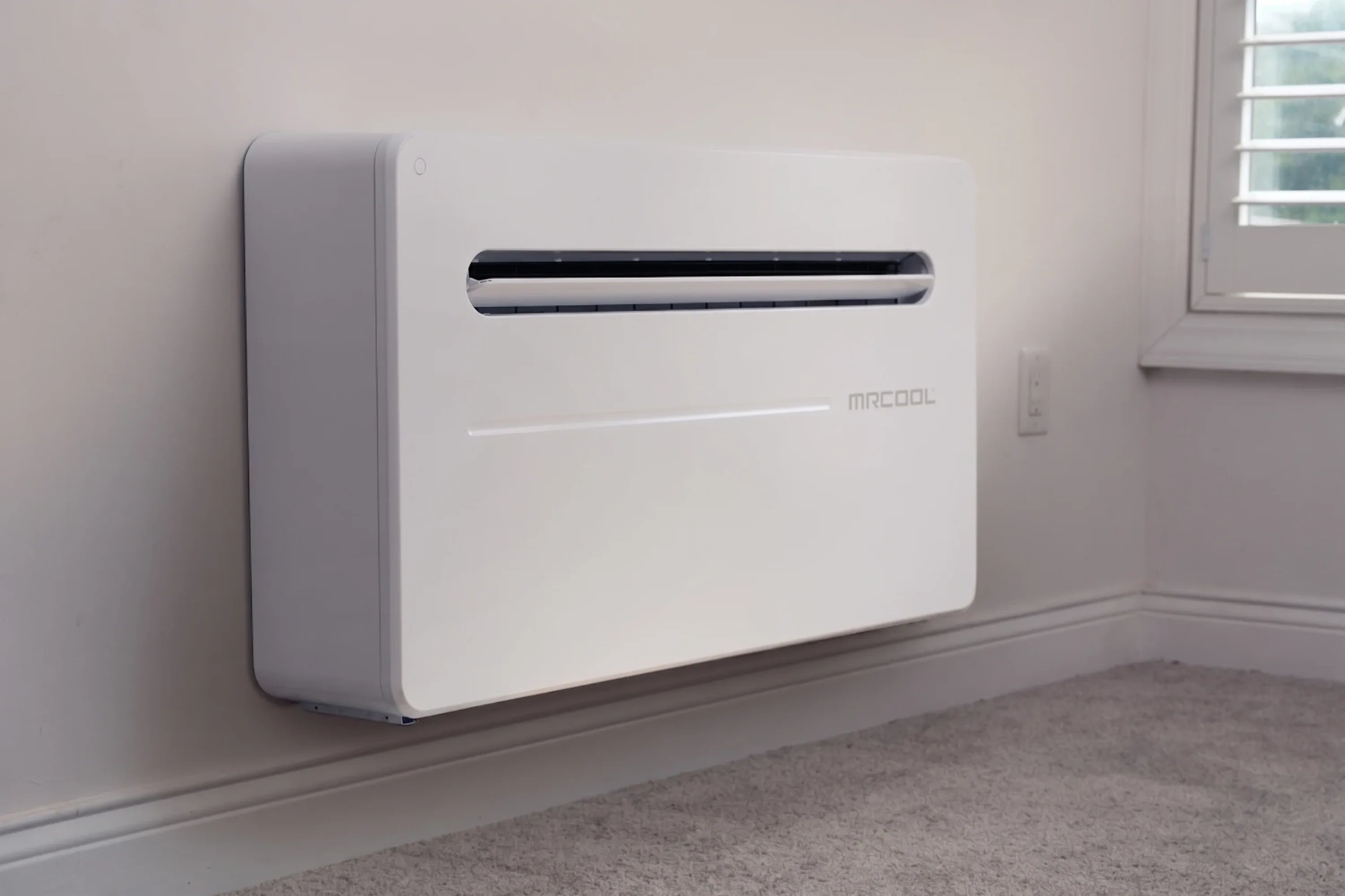 MRCOOL wall-mounted white monoblock air conditioner with front vent and logo