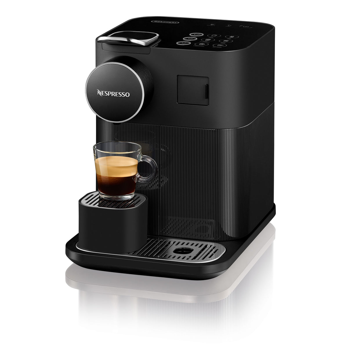 Black Nespresso espresso coffee machine with cup on drip tray
