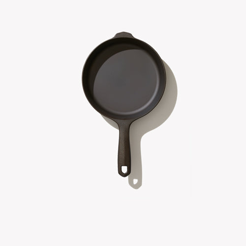 Single black cast iron skillet with short loop handle