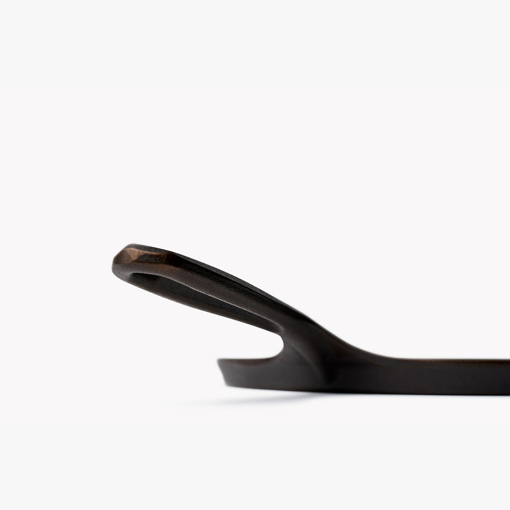 Cast iron griddle handle end in dark finish