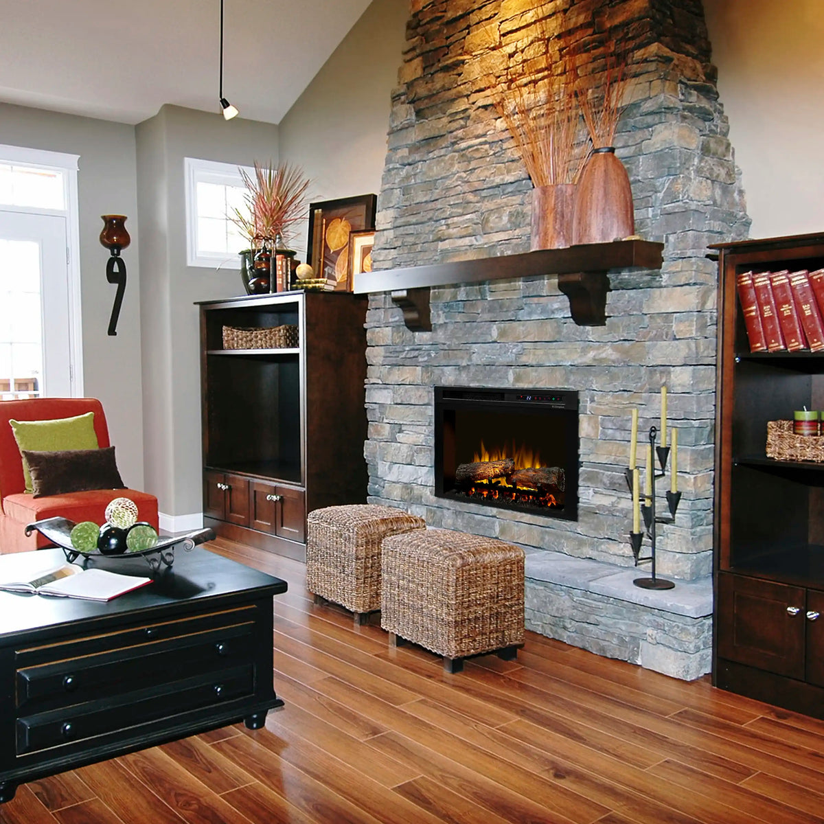Plug-in electric firebox inset in stone fireplace surround with flame effect