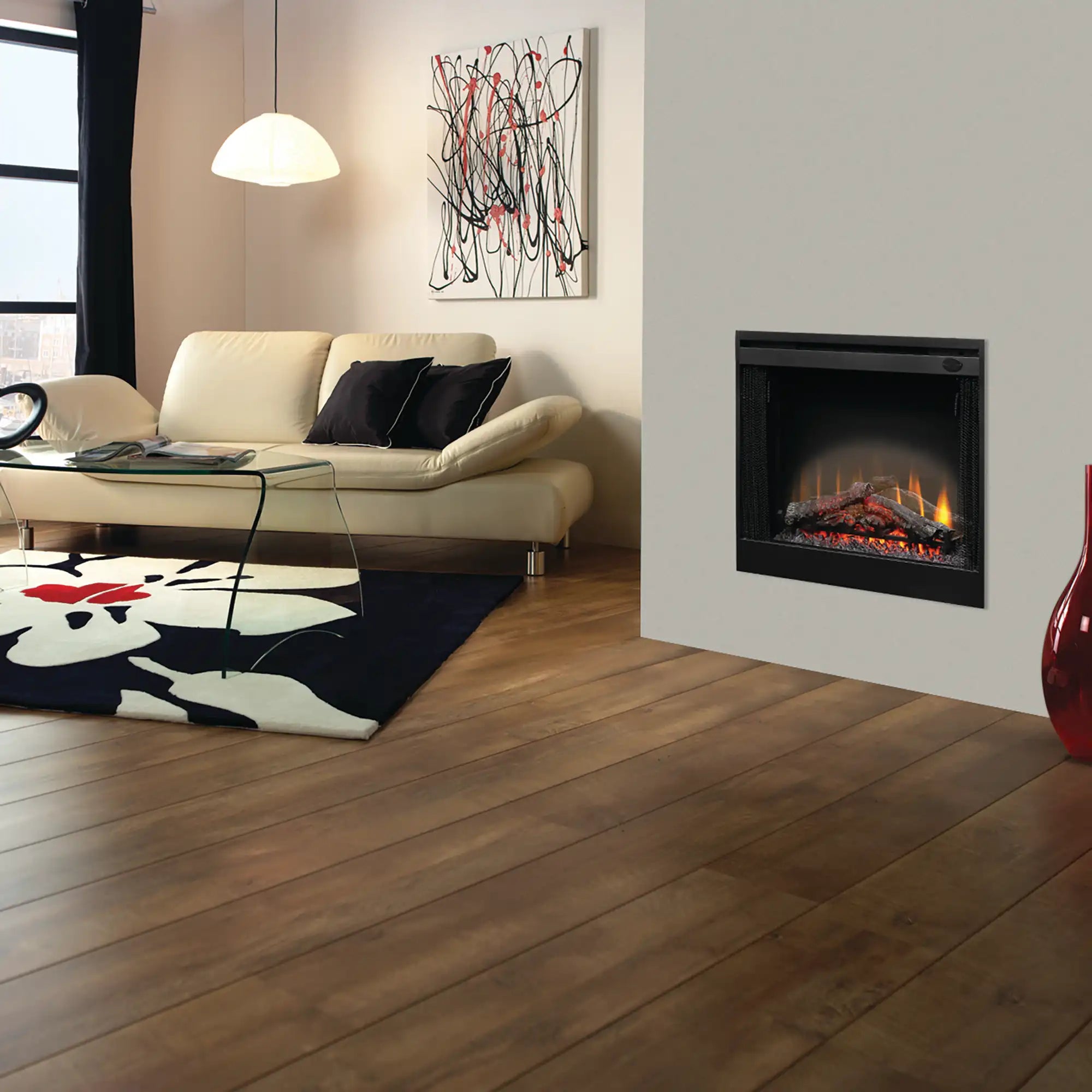 Black electric fireplace insert with glass front showing simulated logs and orange flames