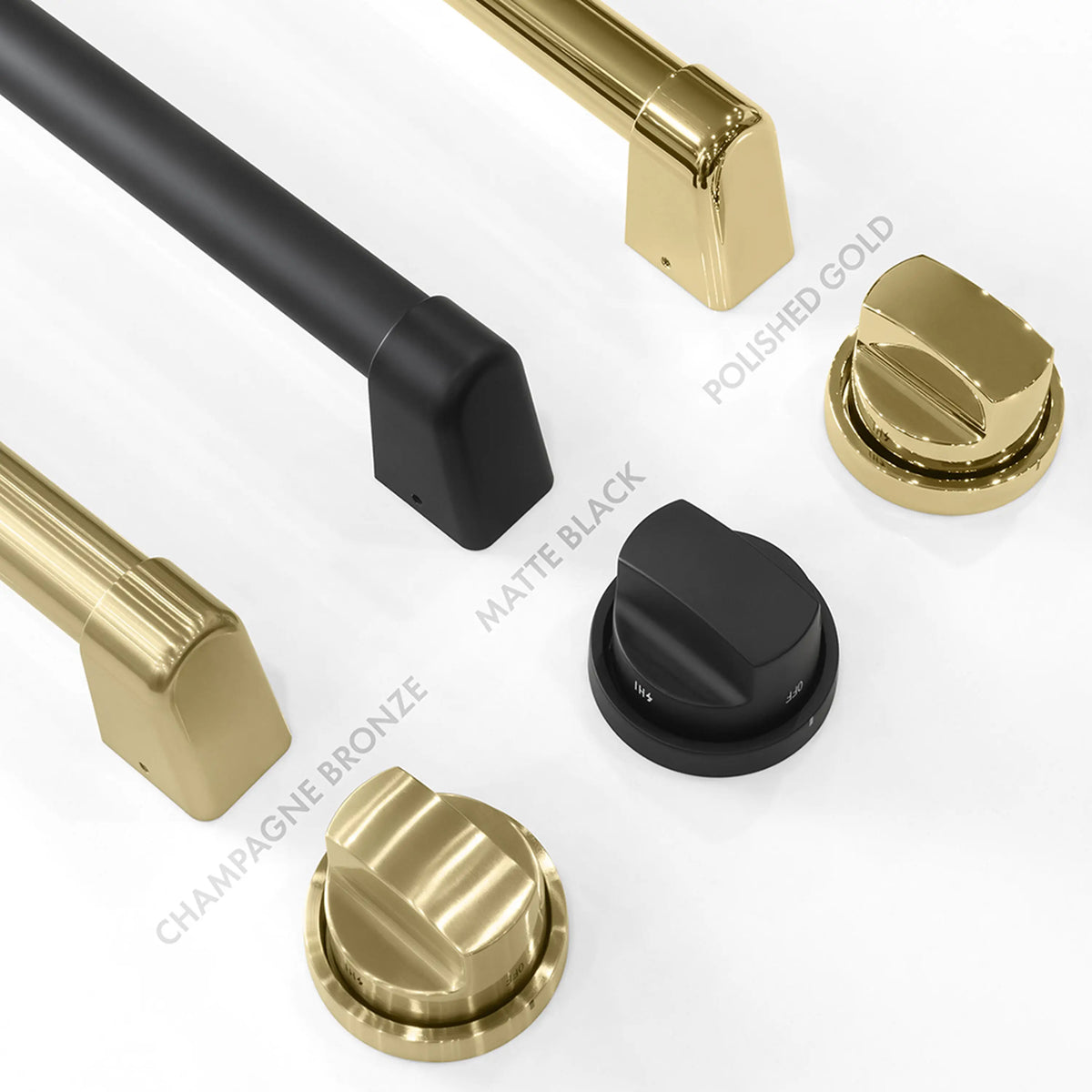 Matte black and gold control knobs on satin stainless steel rangetop edge