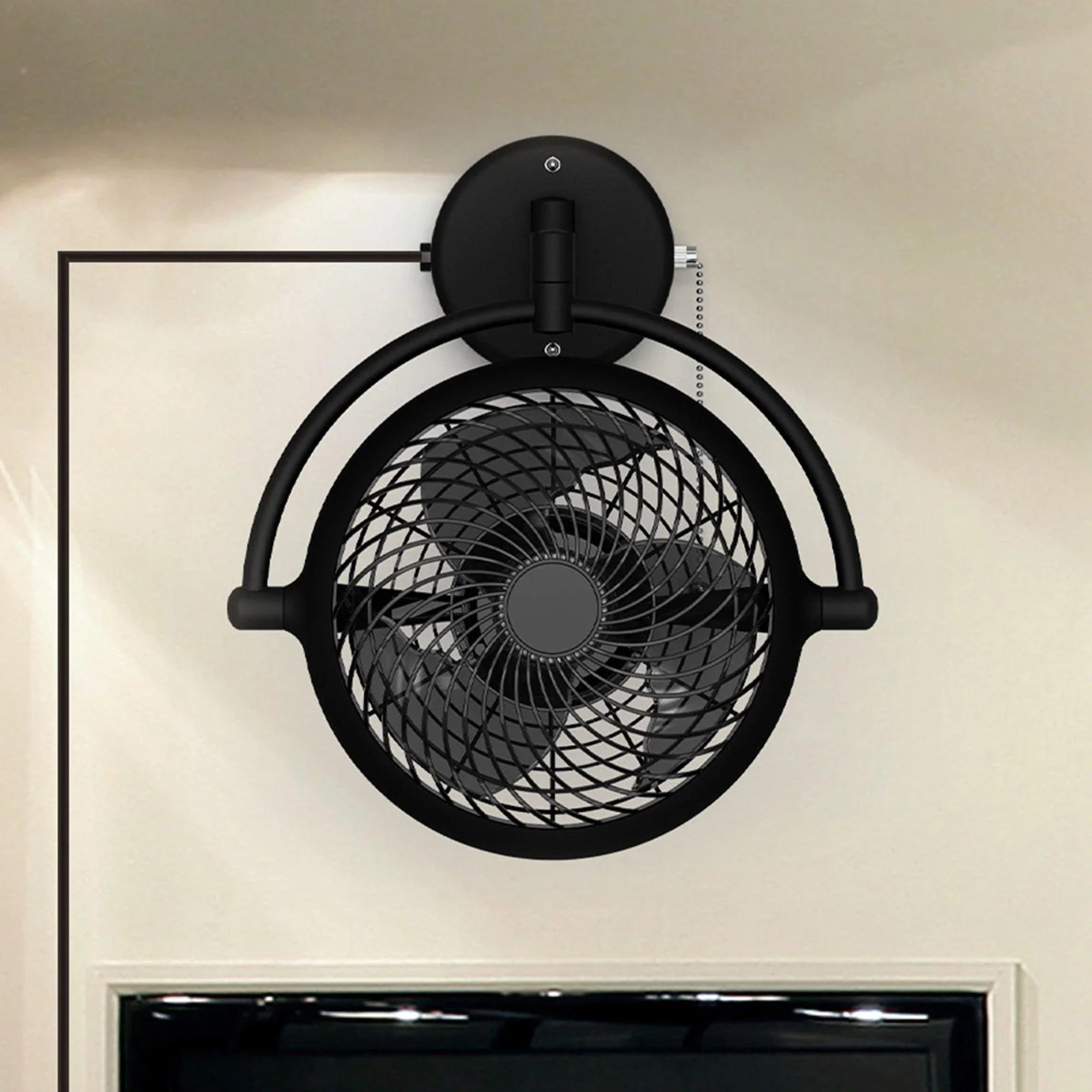 Black industrial ceiling fan with circular metal grille and pull chain control