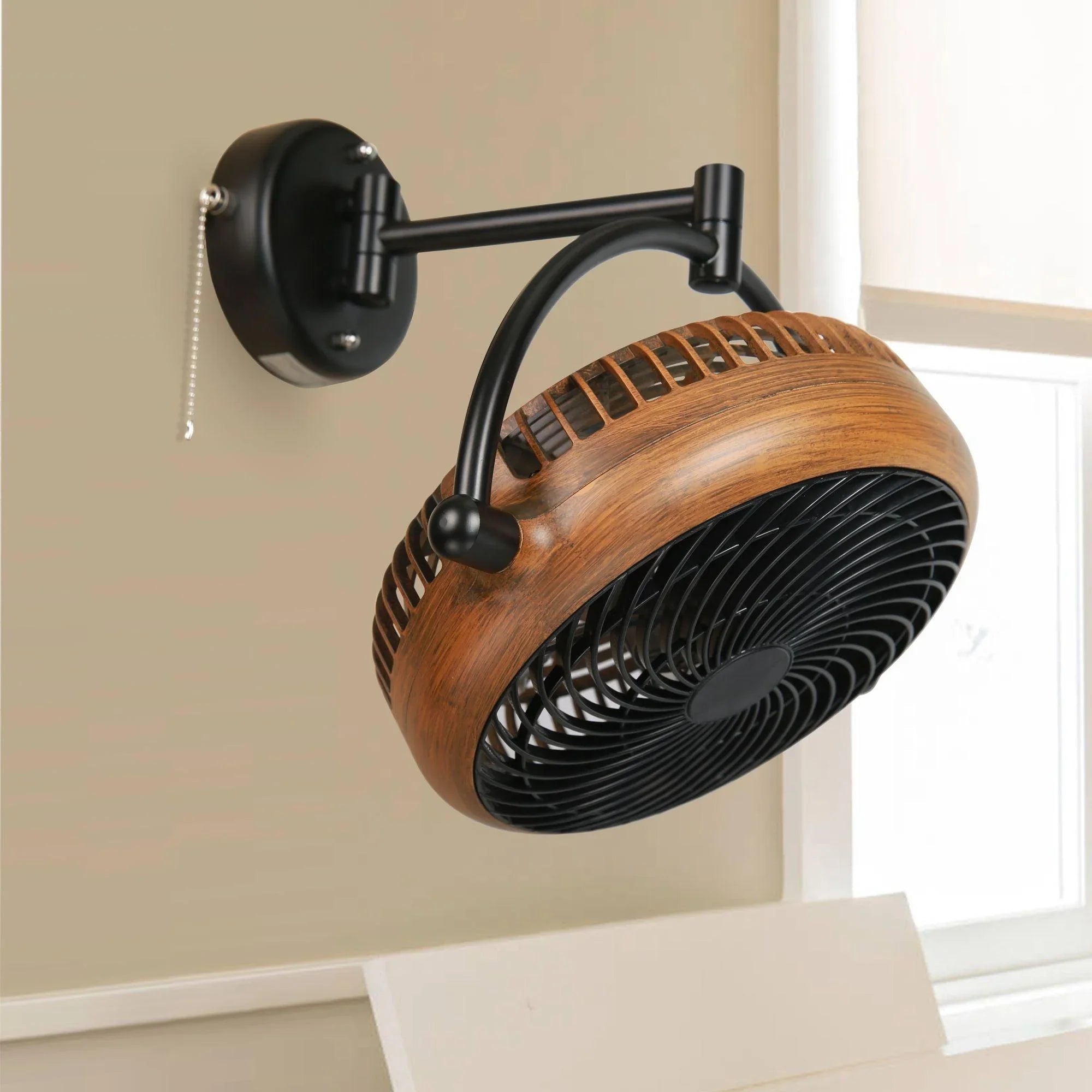 Brown wood-look industrial ceiling fan with black metal cage and pull chain