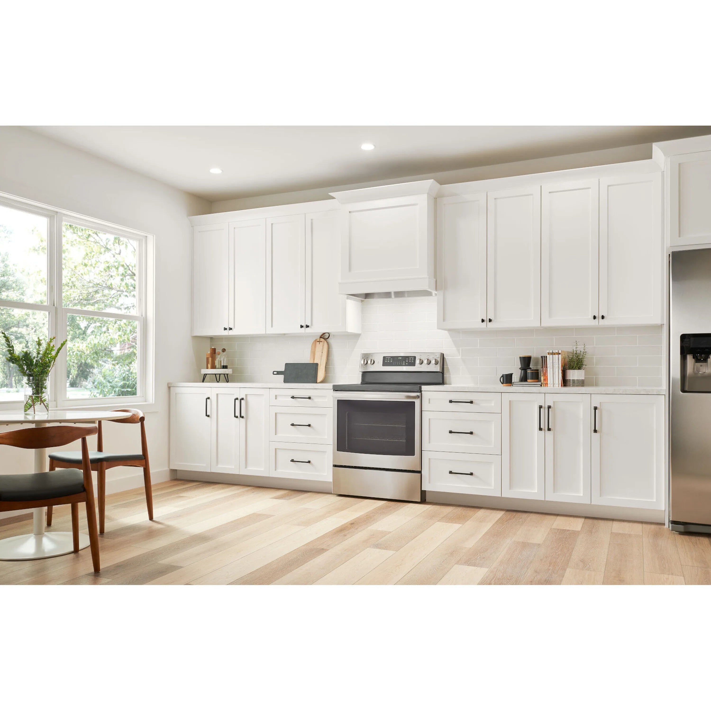 Stainless steel under-cabinet range hood power pack insert above stovetop
