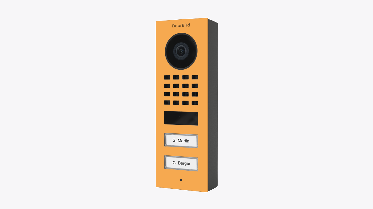 Saffron yellow surface-mount video door station with camera lens and keypad