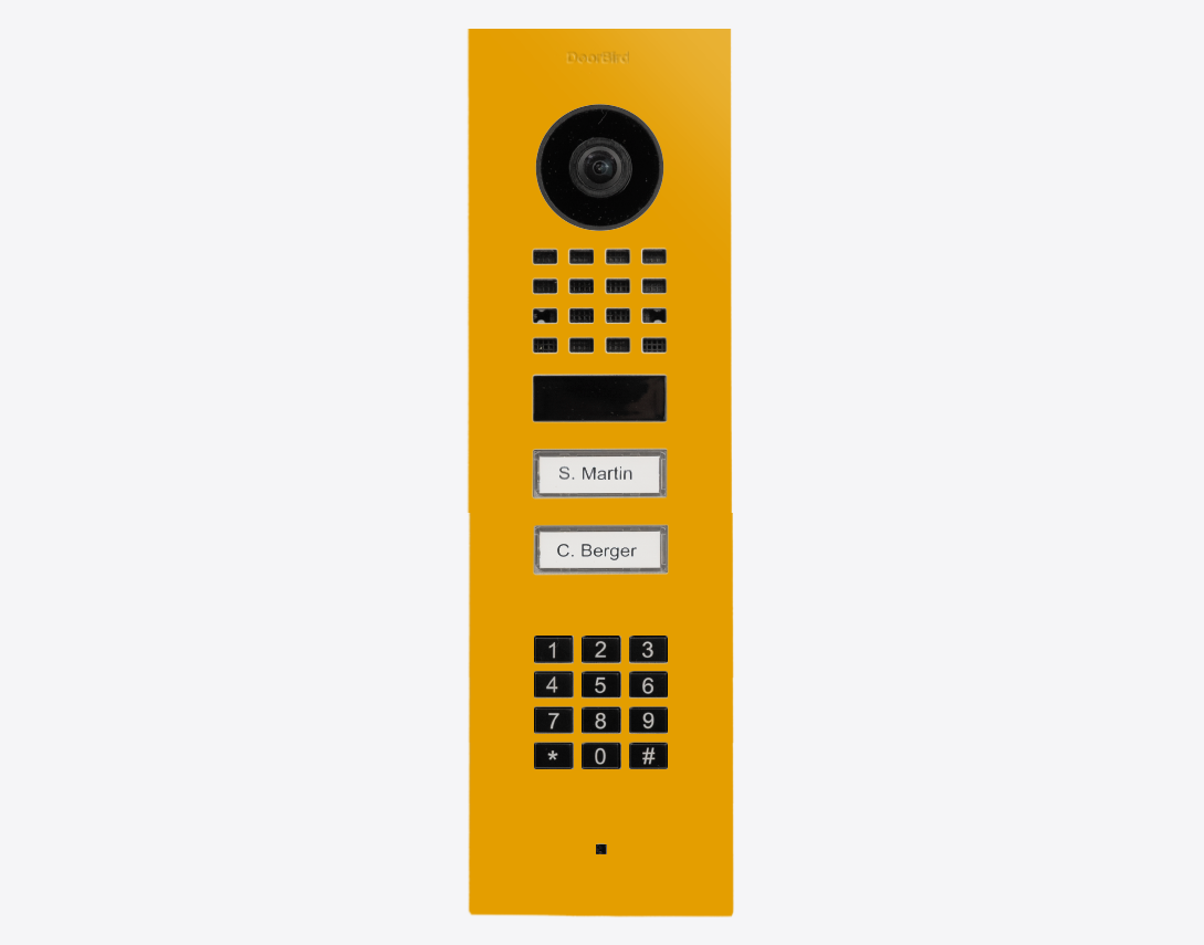 DoorBird flush mount IP video door station in golden yellow with camera and keypad