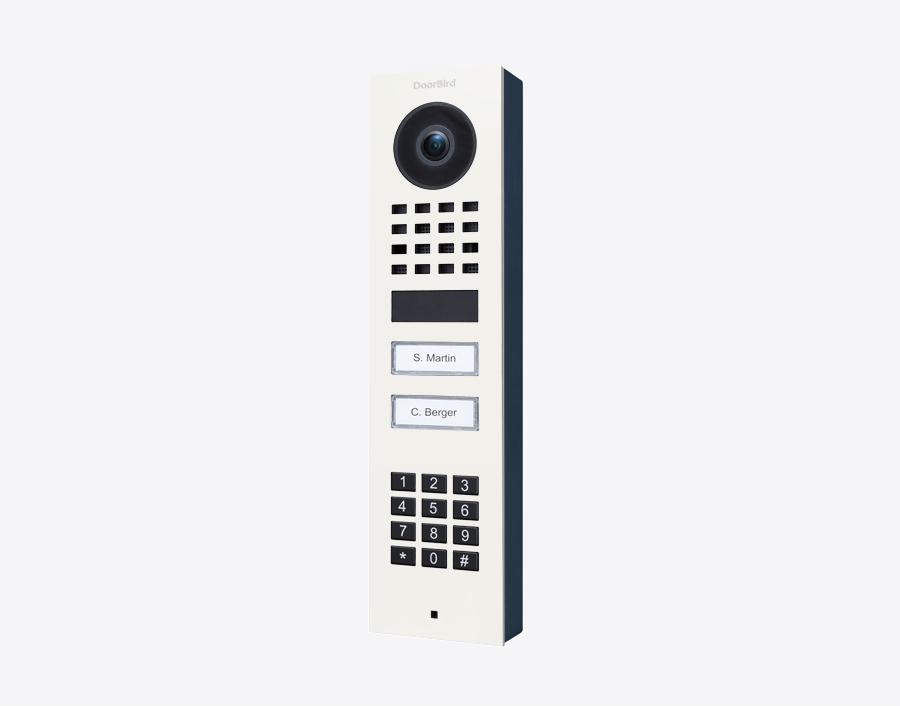 DoorBird IP video door station in traffic white with camera lens, keypad, and two call buttons
