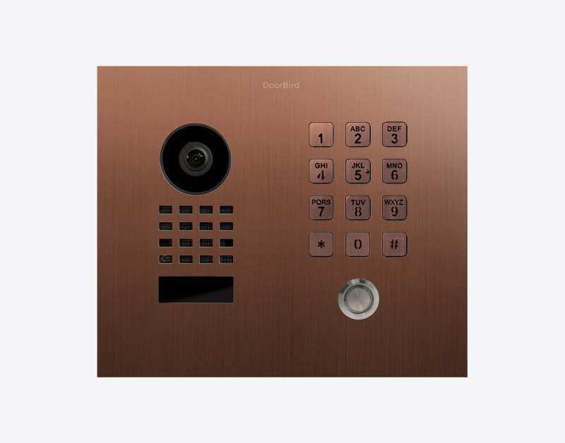 Bronze flush-mount IP video door station with camera lens, numeric keypad, and call button