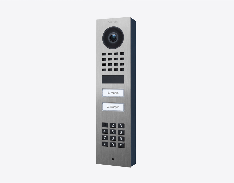 DoorBird surface-mount IP video door station with camera, keypad, and two call buttons
