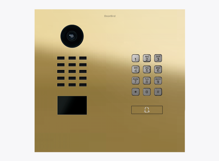 DoorBird brass IP video door station with camera lens, keypad, and call button