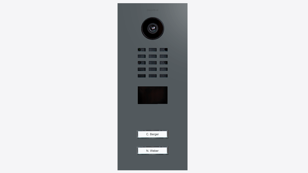 DoorBird IP video door station front view, iron grey panel with camera, speaker grille, labels
