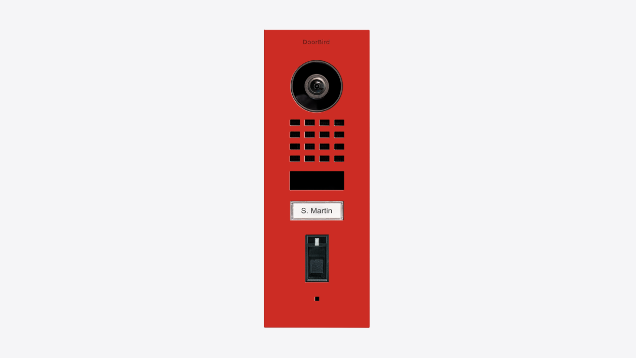 Flush-mount video door station in pure red with camera, keypad, and nameplate