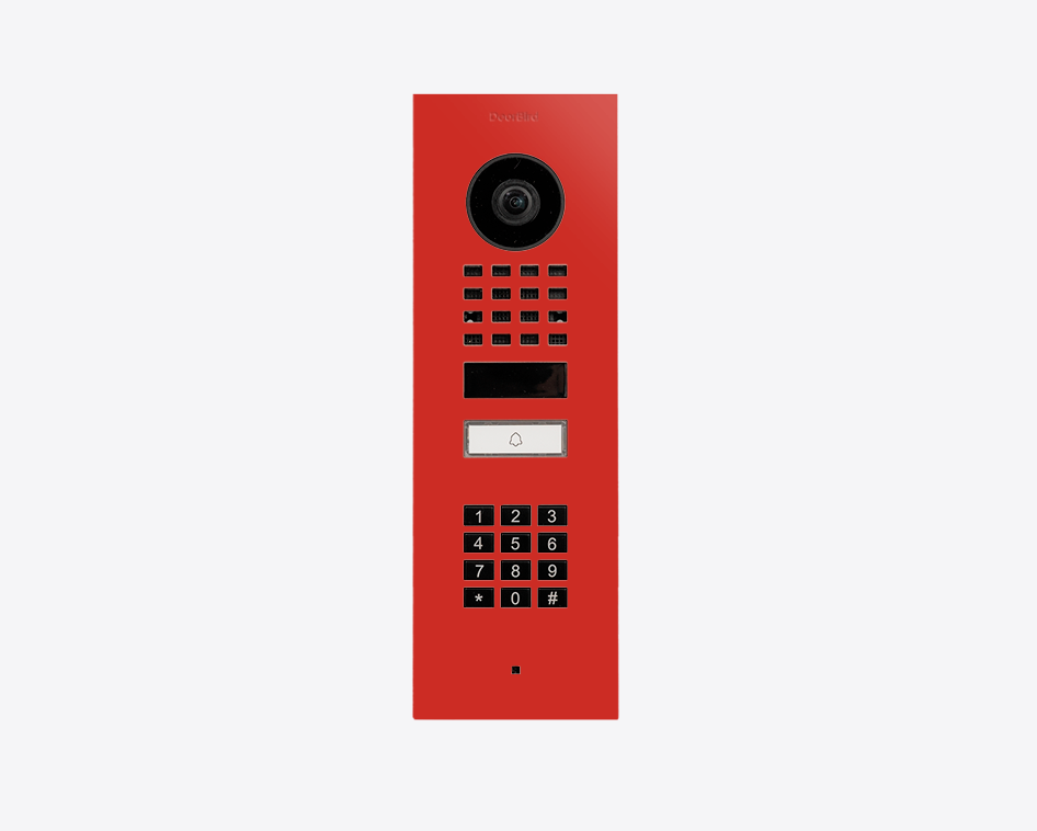 DoorBird flush mount video door station in pure red with camera lens and keypad