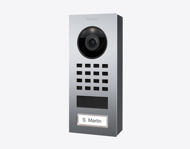 DoorBird surface-mount IP video intercom with camera, keypad, and nameplate labeled “S. Martin”